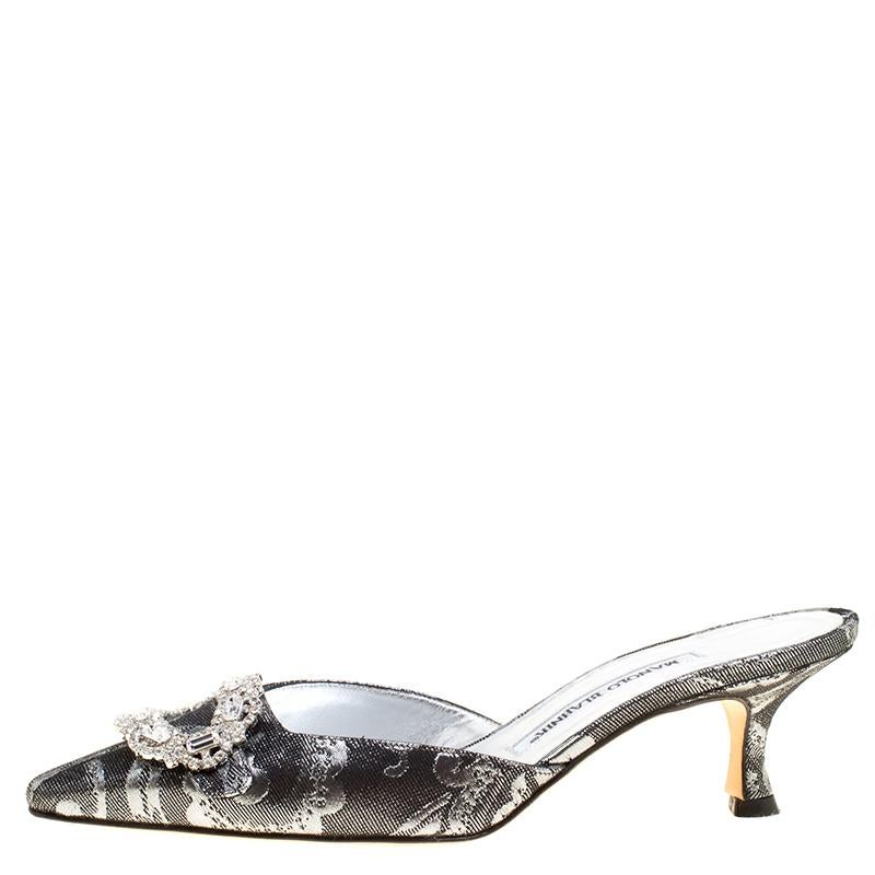 Designed purposely for fashion queens like you, these Manolo Blahnik mules are soul-crushingly gorgeous! They come elevated on 5.5 cm heels and designed with brocade fabric on the pointed toes and crystal-embellished buckles.

Includes: Original