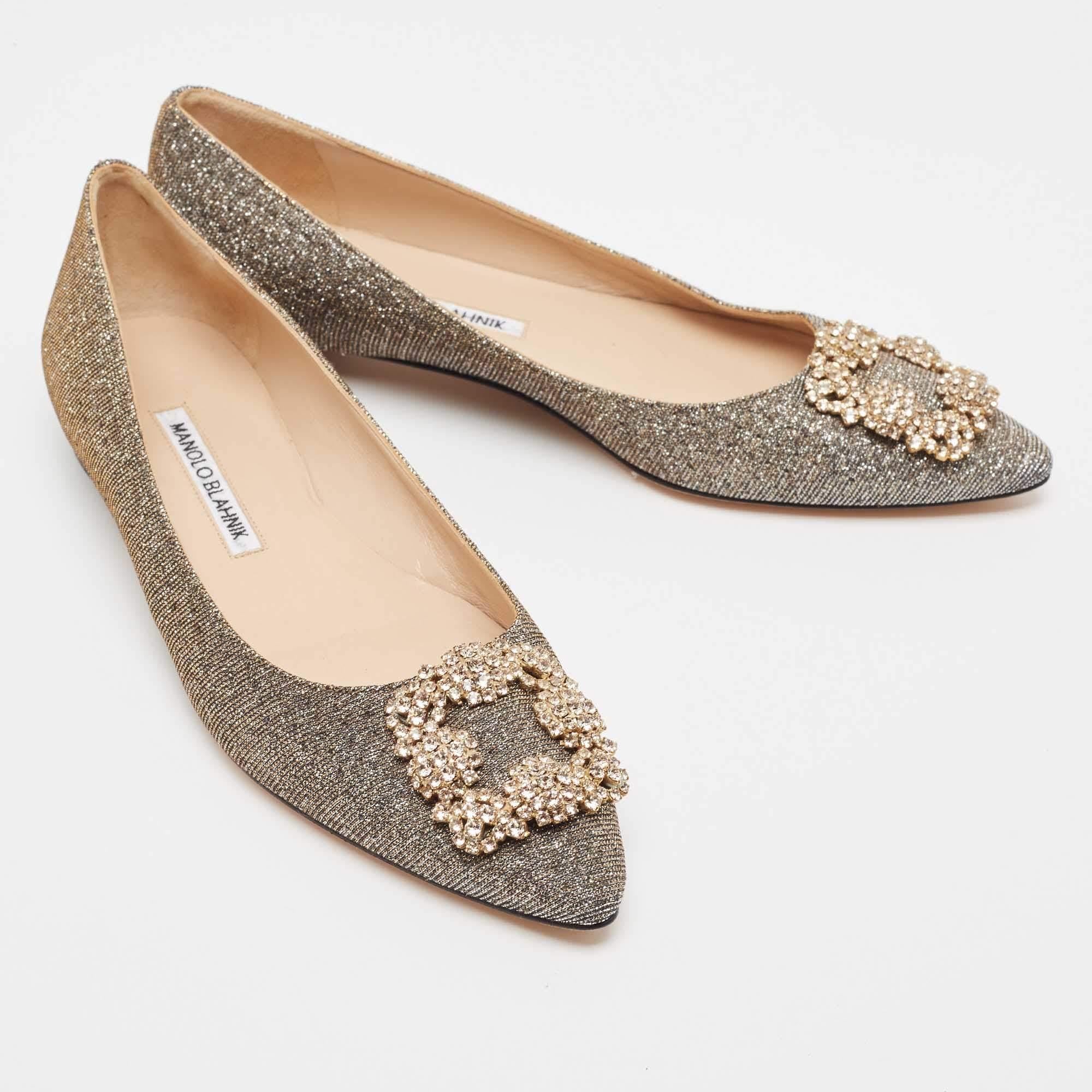 Created by Manolo Blahnik, these ballet flats are a staple style every shoe collection needs. Constructed using lurex fabric, the shoes are highlighted by an embellished buckle.

