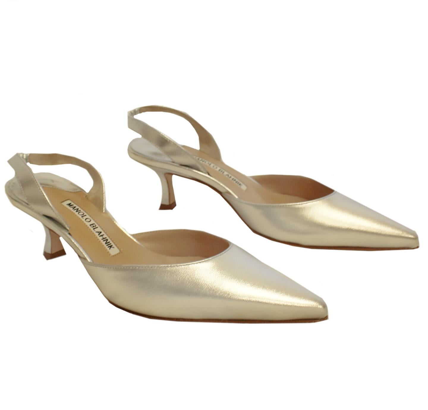 Manolo Blahnik pump in metallic silver tone Carolyne composed of napa leather.  These shoes contain cream leather lining and halter slingback with covered elastic insert.  With 2.8 covered heel and smooth vamp, these Carolyne pumps are one of Manolo
