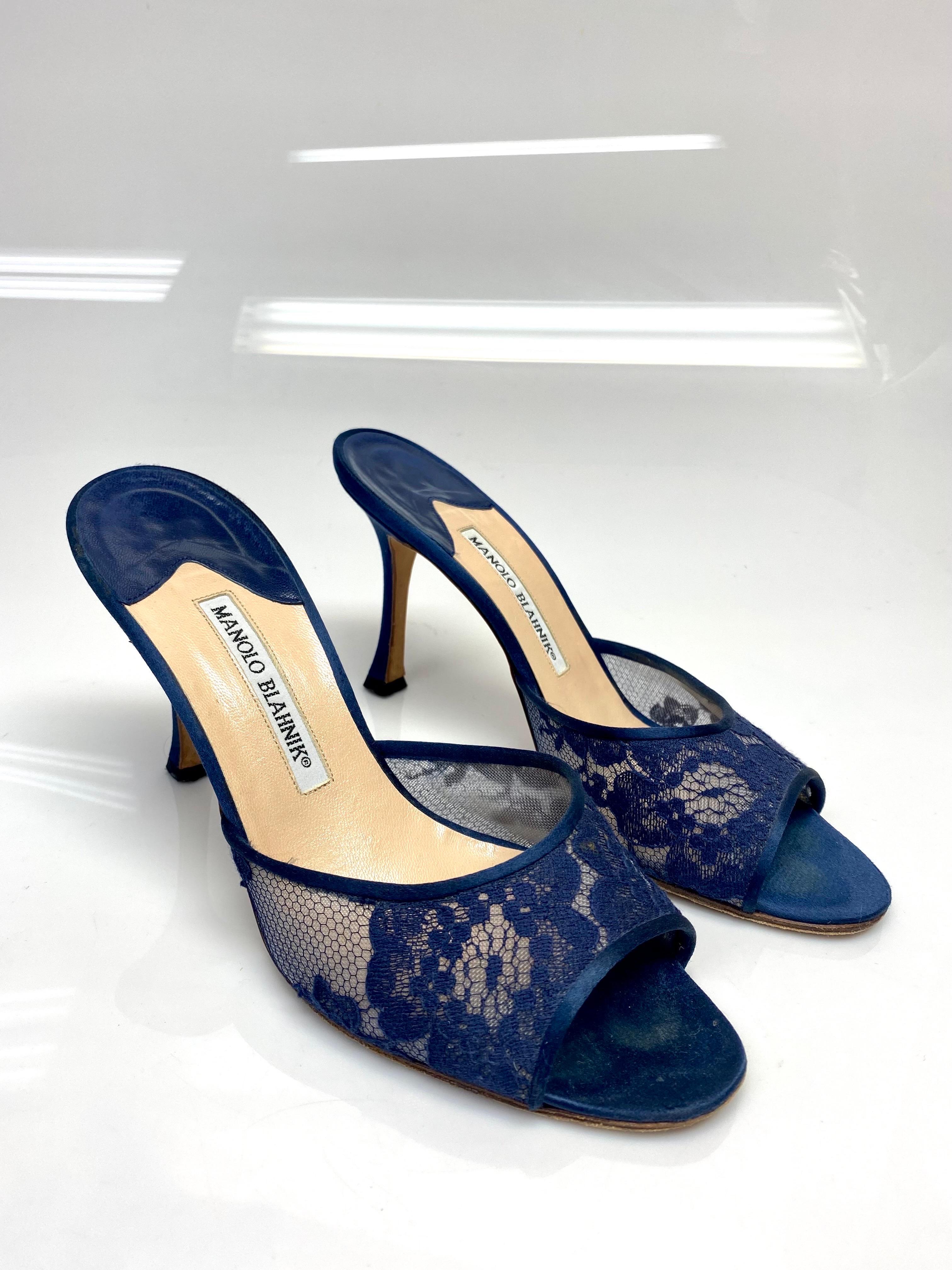 Manolo Blahnik Navy Lace Open Toe Heels size 38.5. It's a name synonymous with incredible footwear. For more than 40 years, Manolo Blahnik has created the world's most sought-after shoes, from classic flats to statement heels. These little lace