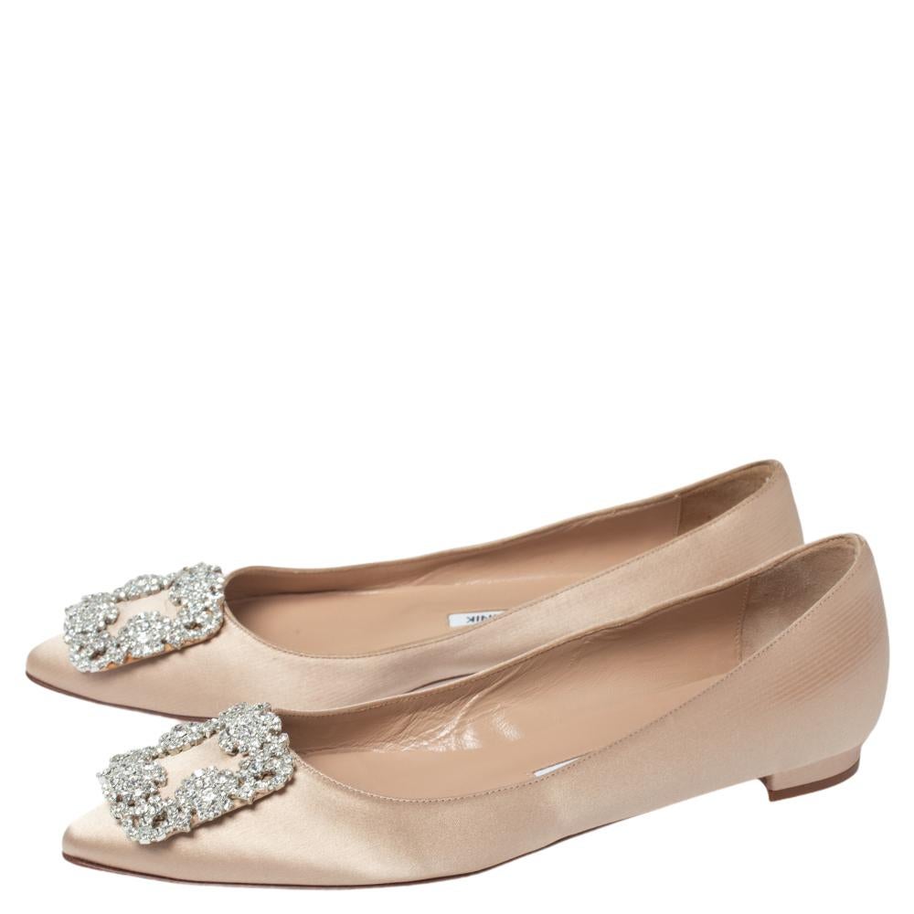 Manolo Blahnik is well-known for his graceful designs, and his label is synonymous with opulence, femininity, and elegance. These Hangisi ballet flats are crafted from satin into a pointed toe silhouette augmented by the embellishments perched on