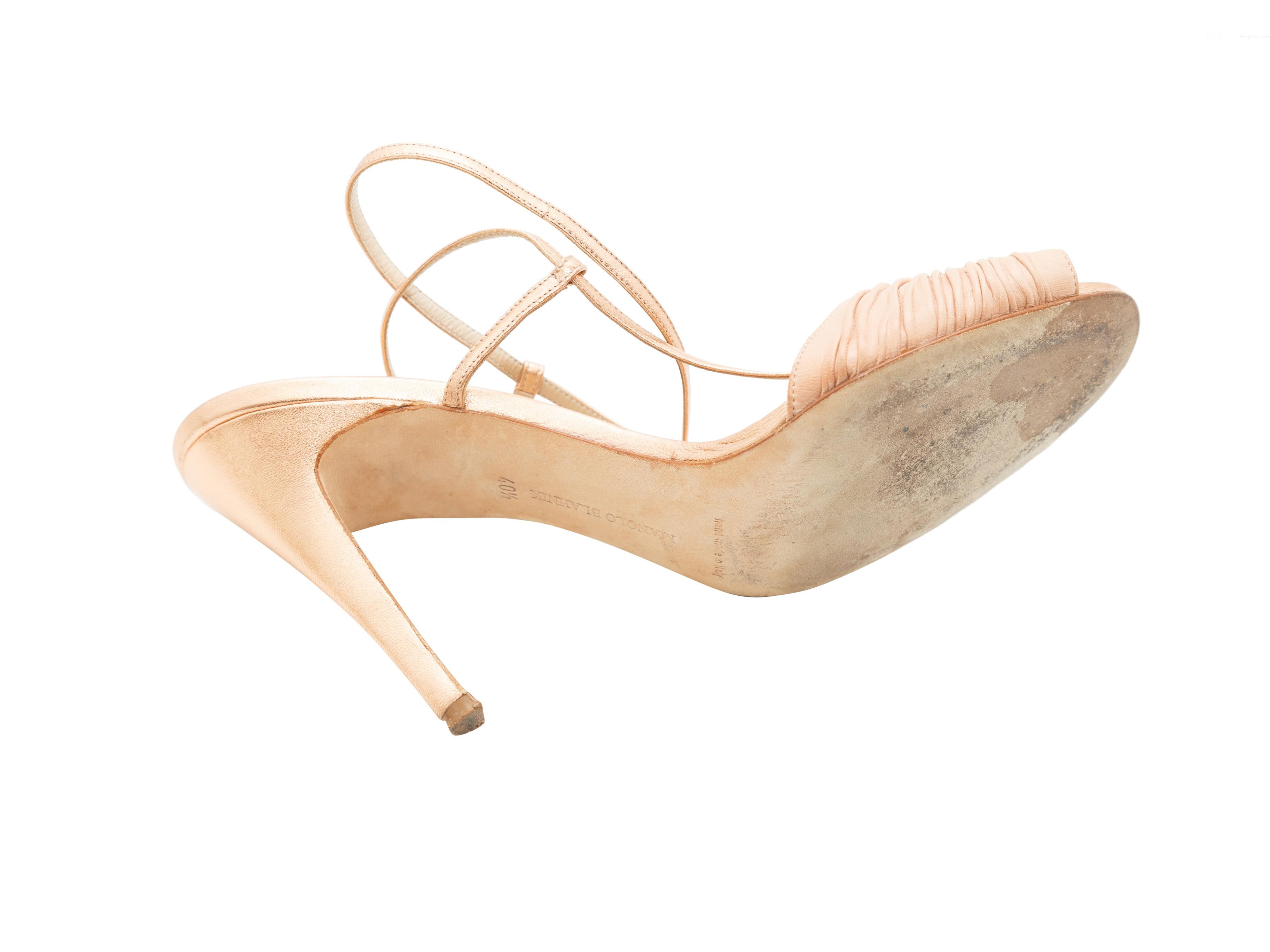 Product details:  Nude and copper leather strappy sandals by Manolo Blahnik.  Adjustable ankle strap.  Peep toe.  4.25