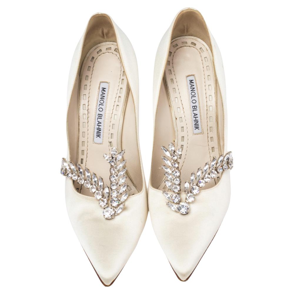 Manolo Blahnik is well-known for his graceful designs, and his label is synonymous with opulence, femininity, and elegance. These Nadira pumps are crafted from satin into a pointed toe silhouette augmented by the embellishments perched on the