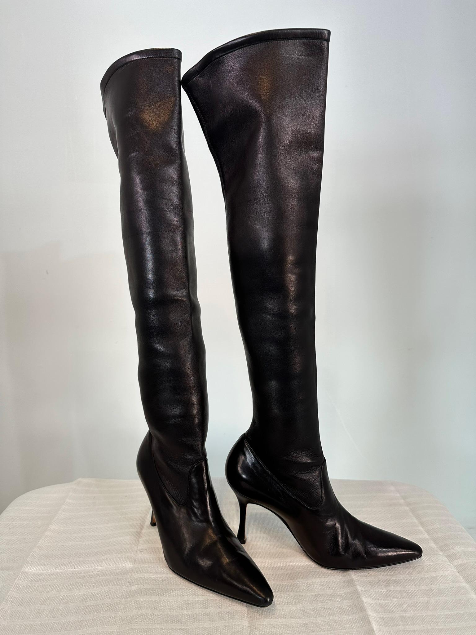 
Manolo Blahnik over-the-knee boot fits like a glove in soft stretch black Nappa leather with pointed toe.

    Manolo Blahnik Nappa leather boot.
    3