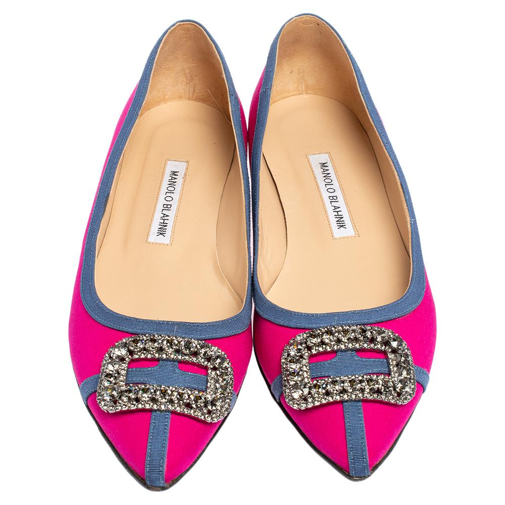 A classic pair of Manolo Blahniks is loved by women all over for its comfort and grace. These pretty shoes are constructed from pink satin and it further made special with a buckle style crystal-embellished design at the front which is unique and