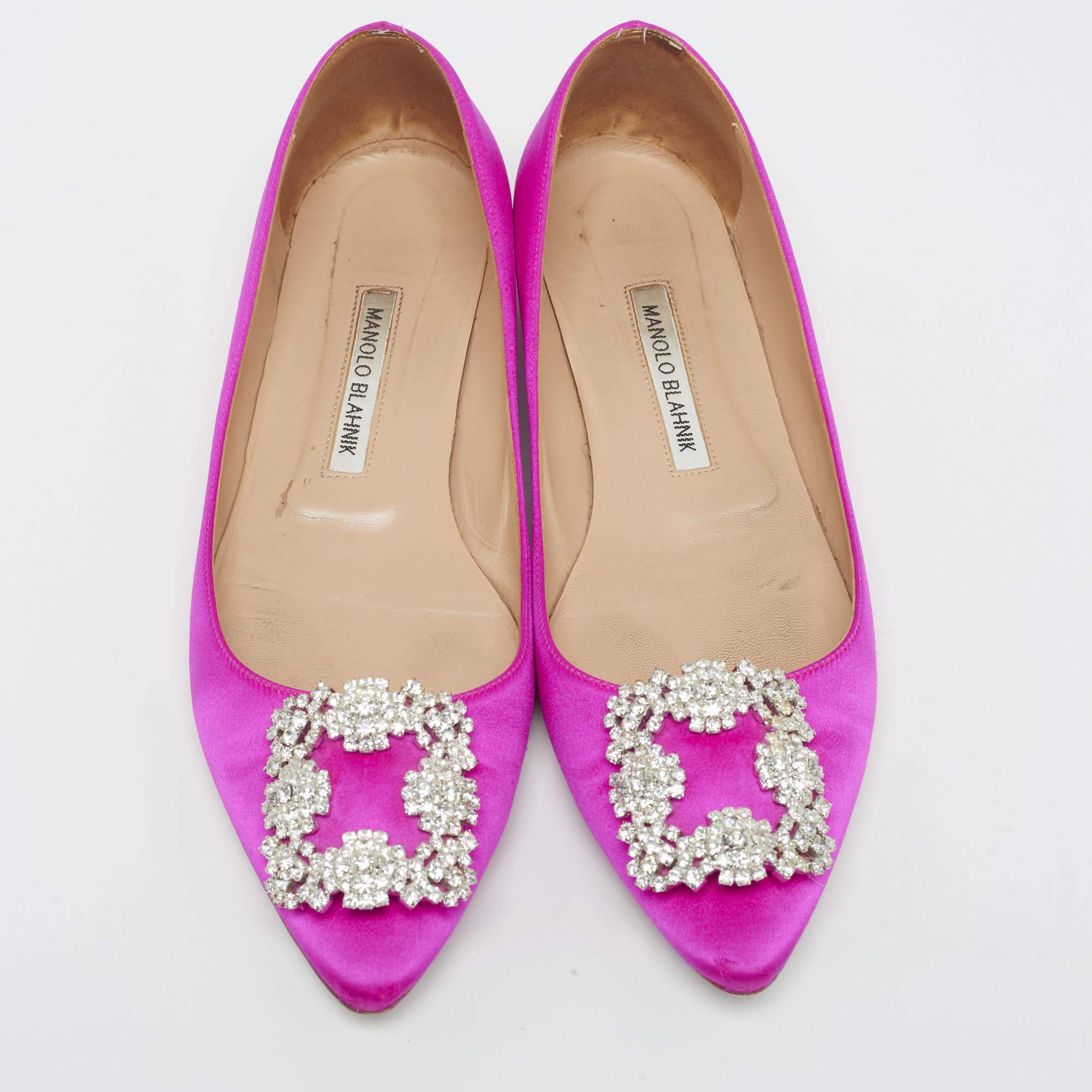 These ballet flats by Manolo Blahnik are comfortable and chic to be matched with everything from a shirt dress to skinny jeans. Crafted from pink satin, they feature covered toes along with the signature buckle on the vamps.

Includes: Original