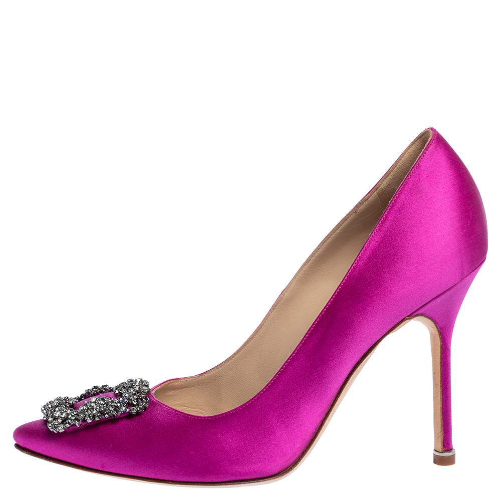 These iconic pumps are by Manolo Blahnik. Styled in a pink hue, with dazzling embellishments on the toes, and leather insoles to provide comfort, these luxurious satin pumps will never fail to lift your outfits. Complete with 10.5 cm heels, you can