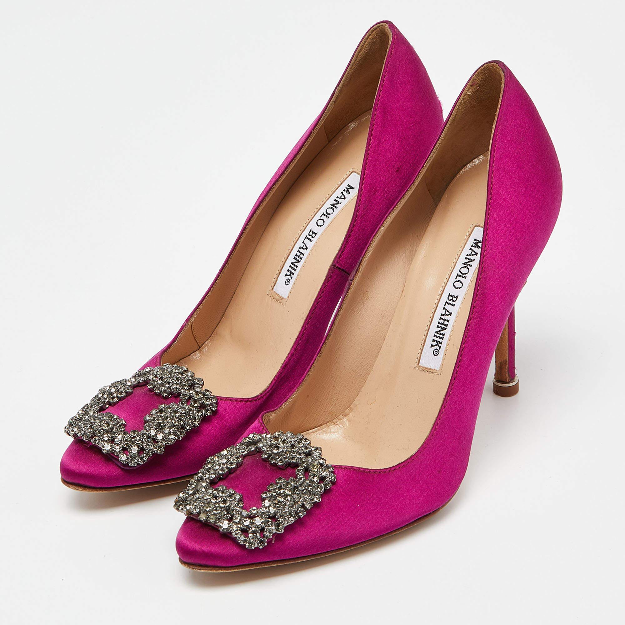The 10.5cm heels of this pair of Manolo Blahnik pumps will reflect grace and luxury in every step. Made from satin, it is made striking with a crystal-embellished buckle detailing on the toes and exhibits branded insoles.

