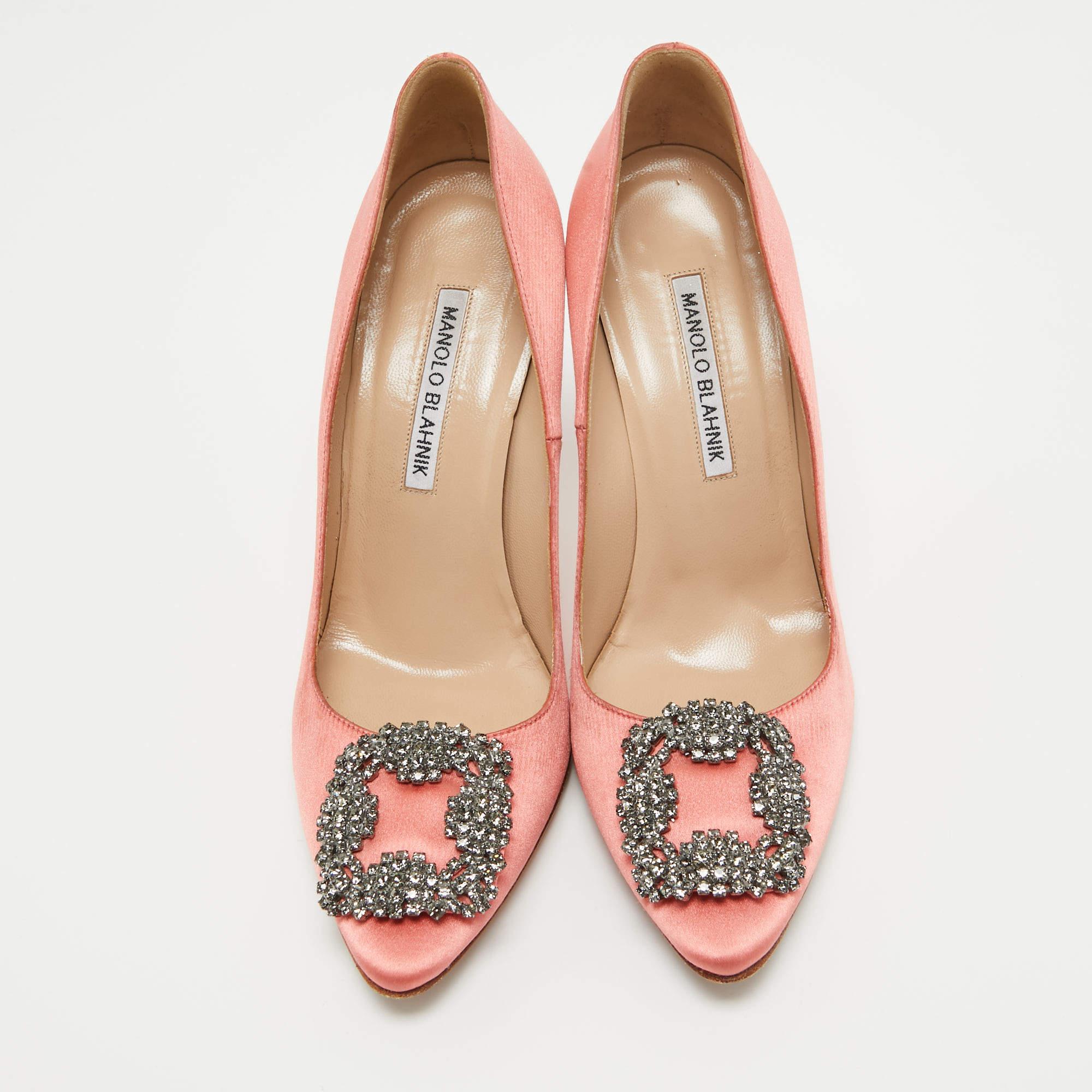 Manolo Blahnik is well-known for designs that embody opulence, femininity, and elegance. Carrying the same traits, these Hangisi pumps come crafted from satin into a covered-toe silhouette augmented by the embellishments perched on the uppers. They