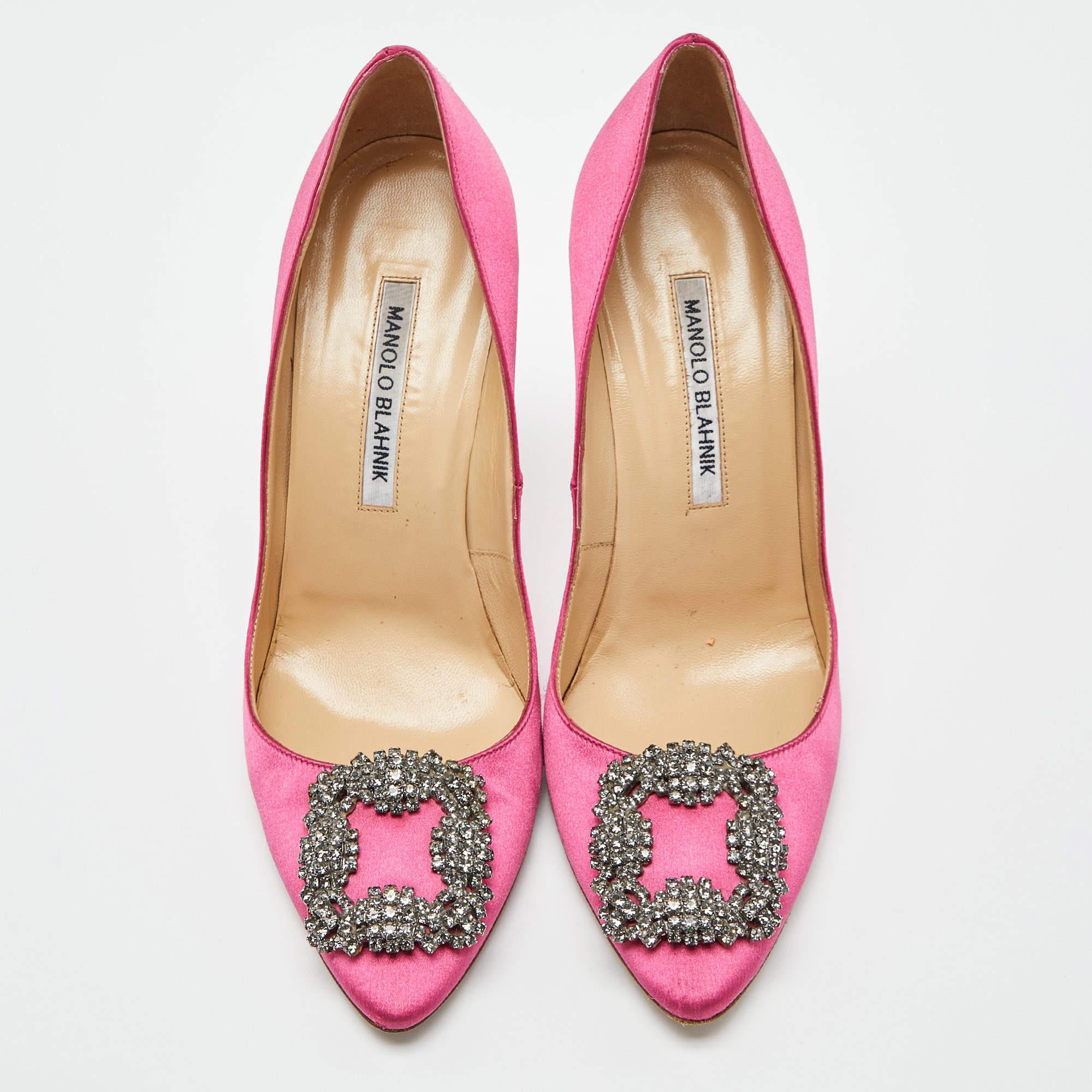 The 10.5cm heels of this pair of Manolo Blahnik pumps will reflect grace and luxury in every step. Made from satin, it is made striking with a crystal-embellished buckle detailing on the toes and exhibits branded insoles.

Includes
Original Dustbag