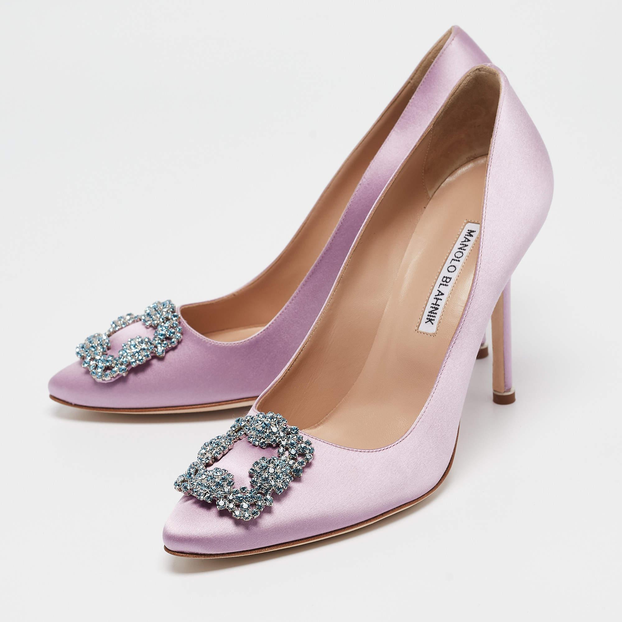 Manolo Blahnik is well known for his graceful designs and his label is synonymous with opulence femininity and elegance. These Hangisi pumps are crafted from satin into a pointed toe silhouette augmented by the embellishments perched on the uppers.