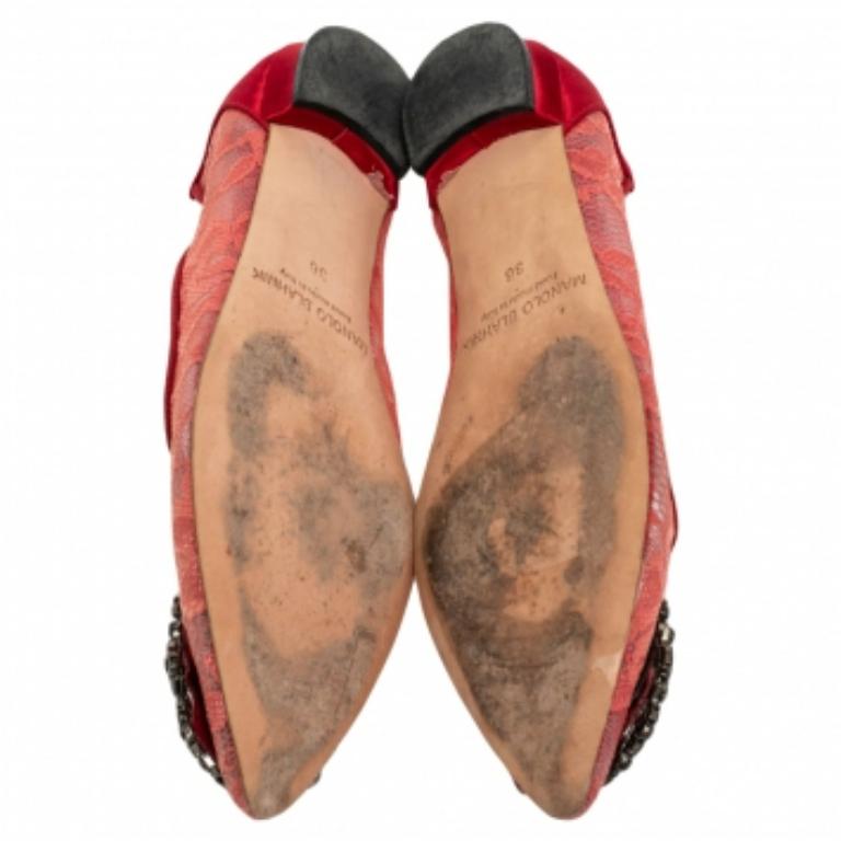 Manolo Blahnik is well-known for his graceful designs, and his label is synonymous with opulence, femininity, and elegance. These Hangisi ballet flats are crafted from lace and satin into a pointed toe silhouette augmented by the embellishments