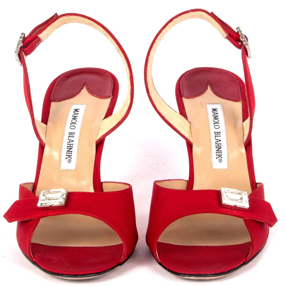 100% authentic Manolo Blahnik sandals in red silk embellished with crystals. Have been worn and are in excellent condition. 

Imprinted Size	38.5
Shoe Size	38.5
Inside Sole	25cm (9.8in)
Width	7.5cm (2.9in)
Heel	9cm (3.5in)

All our listings include