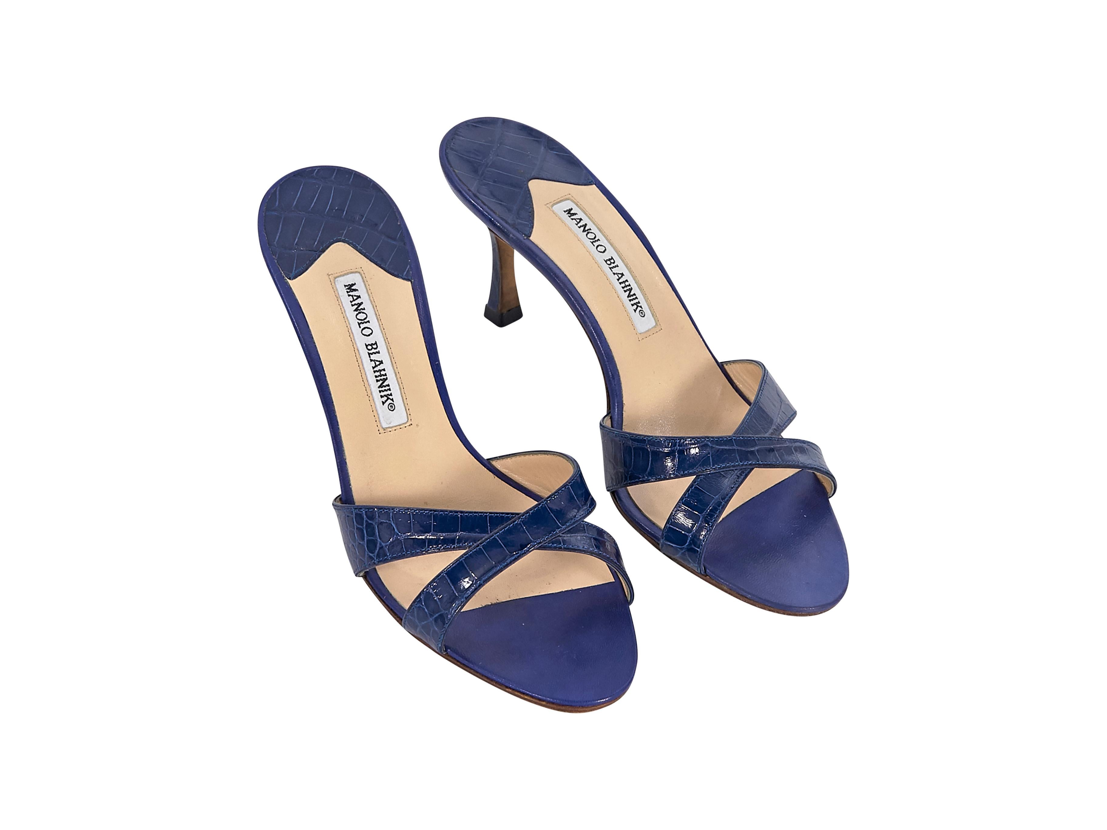 Product details:  Royal blue crocodile mule sandals by Manolo Blahnik.  Crisscross vamp.  Open toe.  Slip-on style.  2.5