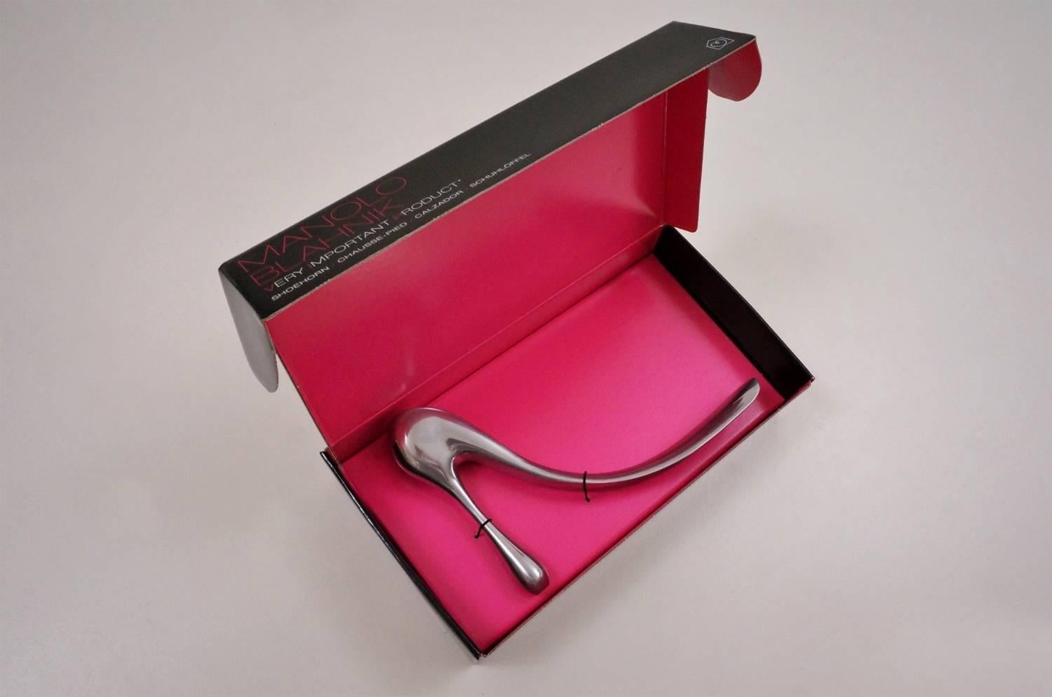 Manolo Blahnik shoe horn polished cast aluminium with original box, 2004, English.

Manolo Blahnik`s iconic shoe horn was a collaboration with UK based store Habitat, to celebrating its 40th anniversary in 2004.

The original box includes the