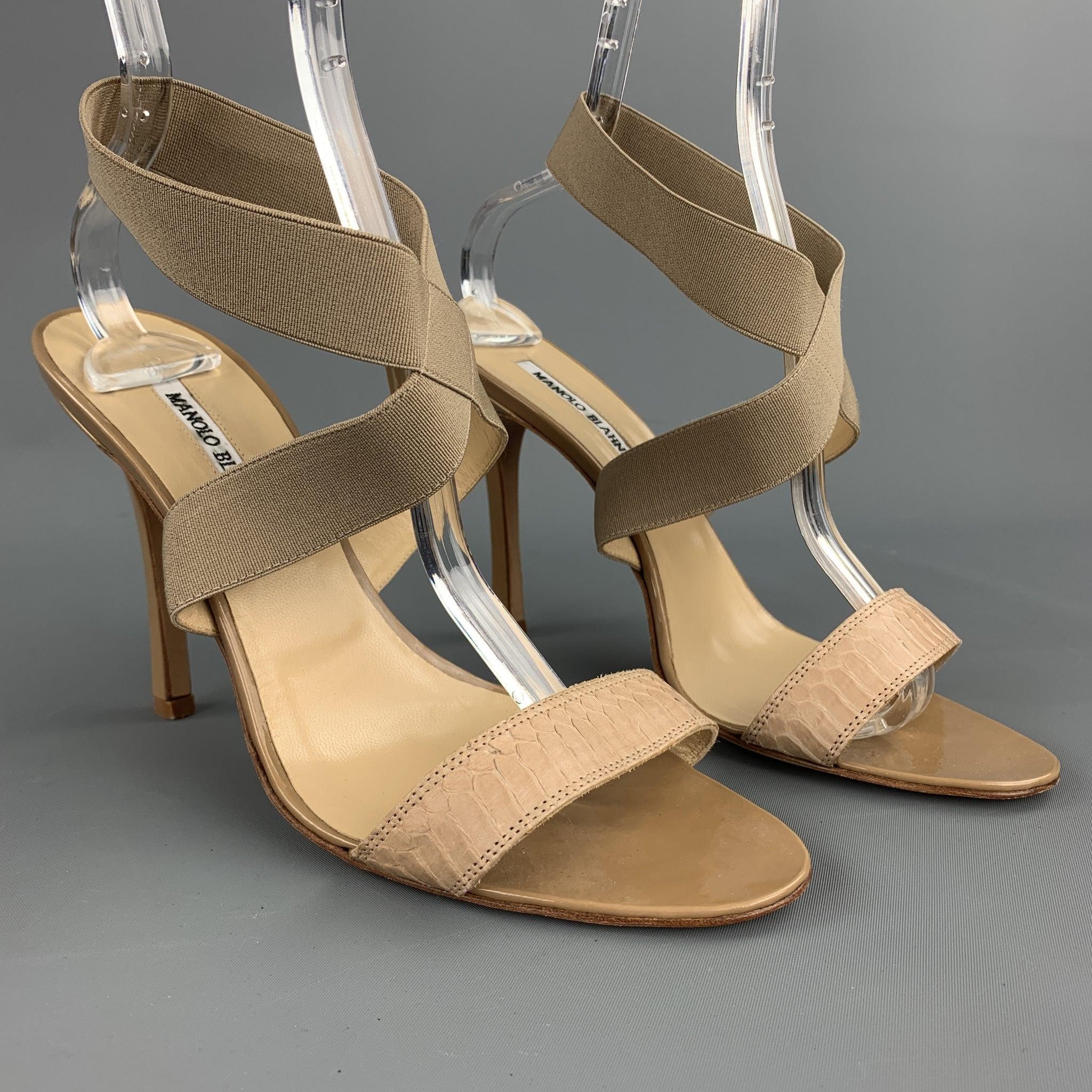 MANOLO BLAHNIK heel sandals comes in a beige leather with a snakeskin trim featuring a elastic strap. Handmade in Italy.Good
Pre-Owned Condition. 

Marked:   EU 40 

Measurements: 
  Heel: 4.5 inches 

  
  
 
Reference: 104816
Category: