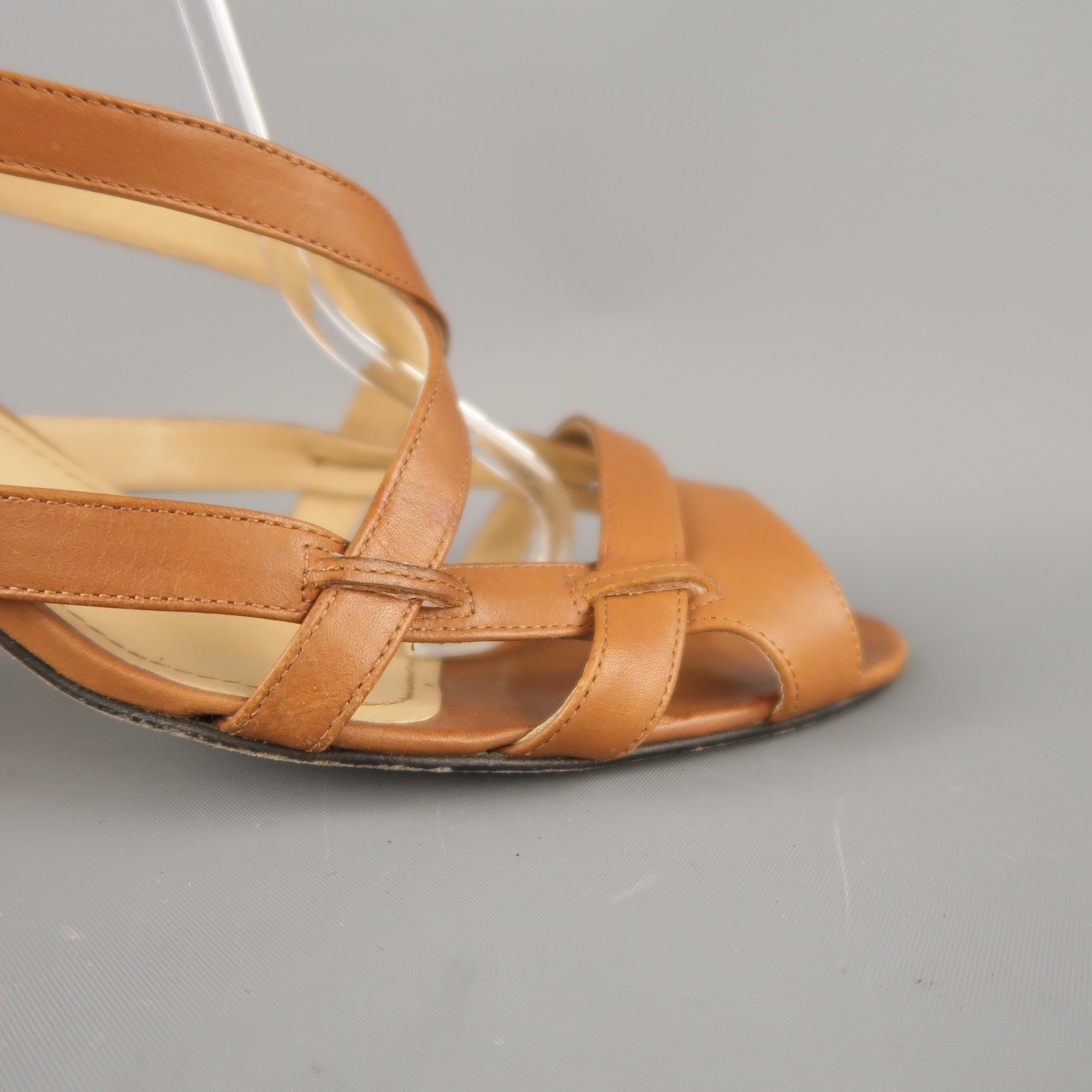 MANOLO BLAHNIK sandals come in light tan brown leather with a strappy peep toe, crossed strap and covered heel with ankle strap. Made in Italy.
 
Good Pre-Owned Condition.
Marked: IT 42
 
Measurements:
 
Heel: 3 in.