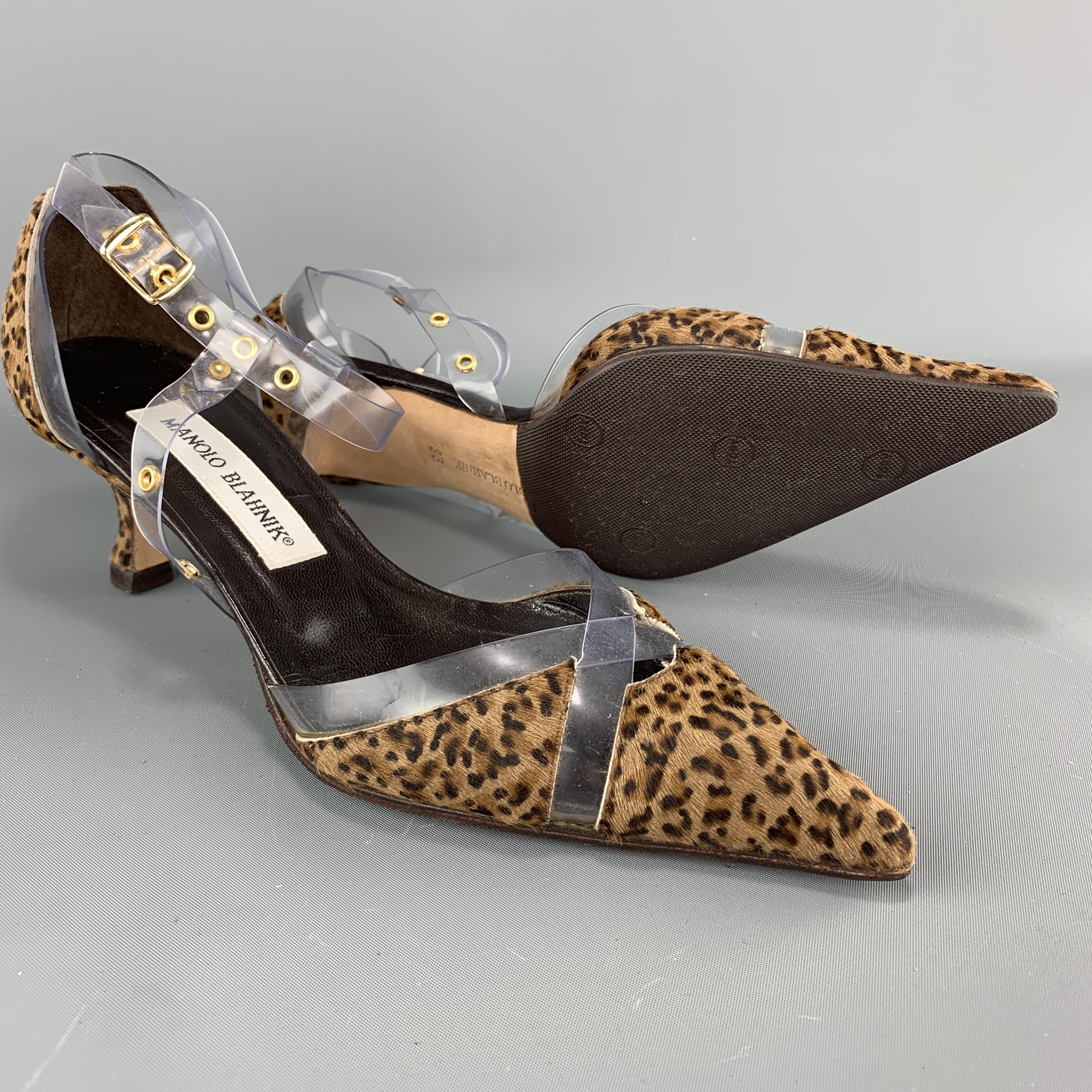 MANOLO BLAHNIK d'orsay pumps come in leopard print ponyhair leather with a covered kitten heel, pointed toe with X straps, and clear vinyl ankle harness.

Very Good Pre-Owned Condition.
Marked: IT 36

Heel: 2.25 in. 