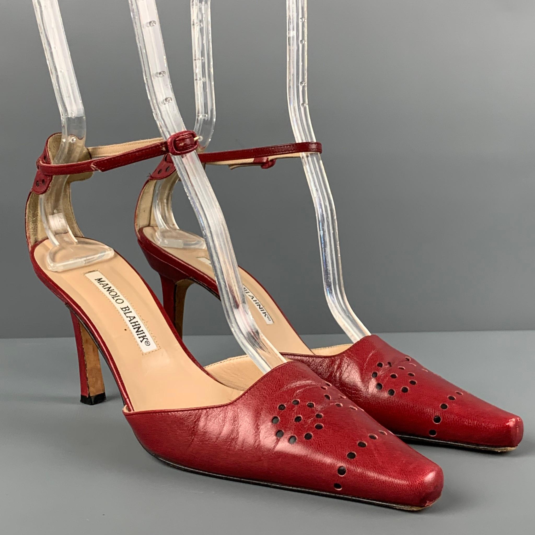 MANOLO BLAHNIK pumps comes in a red perforated leather featuring a square toe, ankle strap, and a stiletto heel. Made in Italy. 

Good Pre-Owned Condition.
Marked: 36.5

Measurements:

Heel: 3.25 in. 