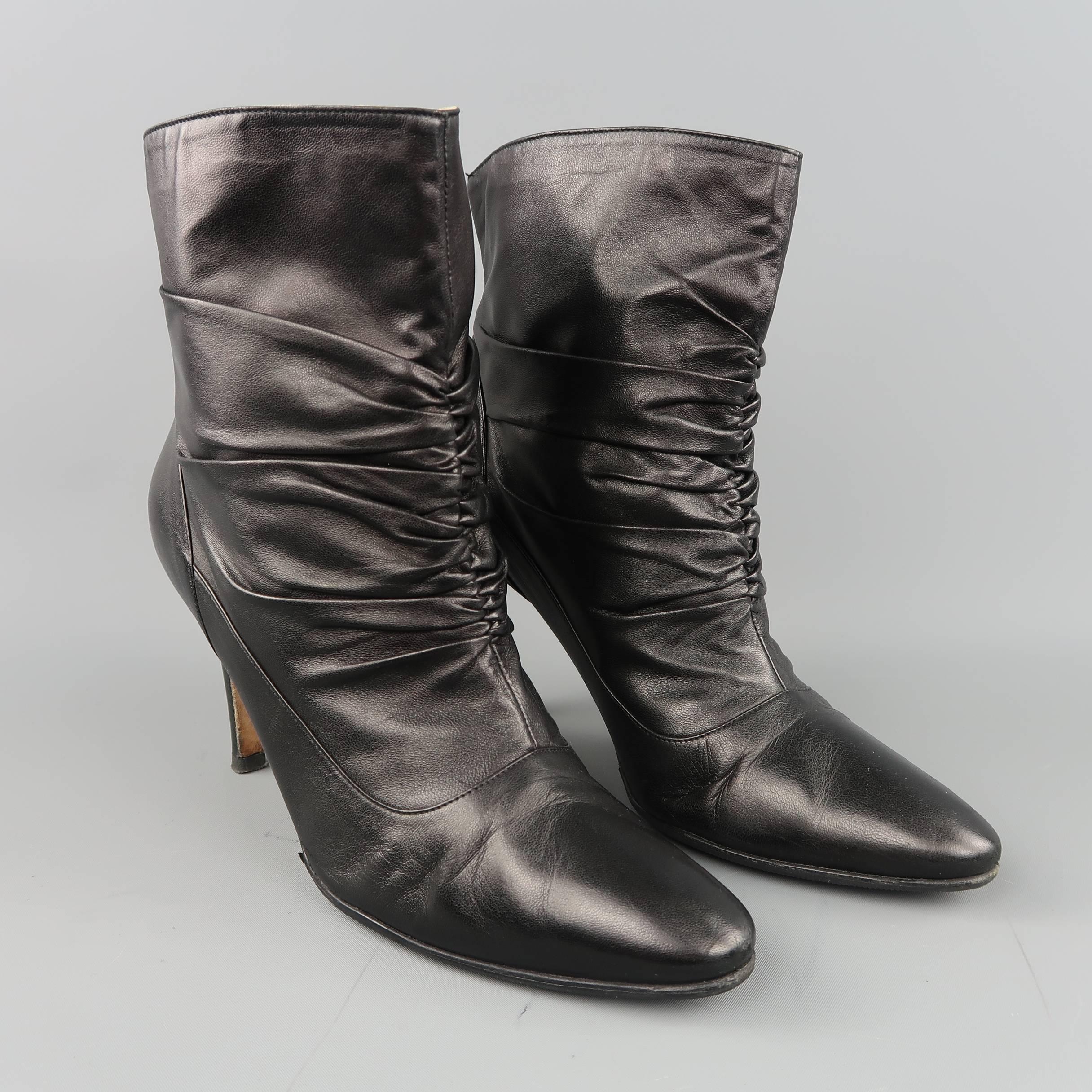 MANOLO BLAHNIK ankle boots come in smooth black leather with a pointed toe, covered stiletto heel, and ruched front detail. Resoled. Made in Italy.
 
Good Pre-Owned Condition.
Marked: IT 38.5
 
Measurements:
 
Heel: 3.5 in.
