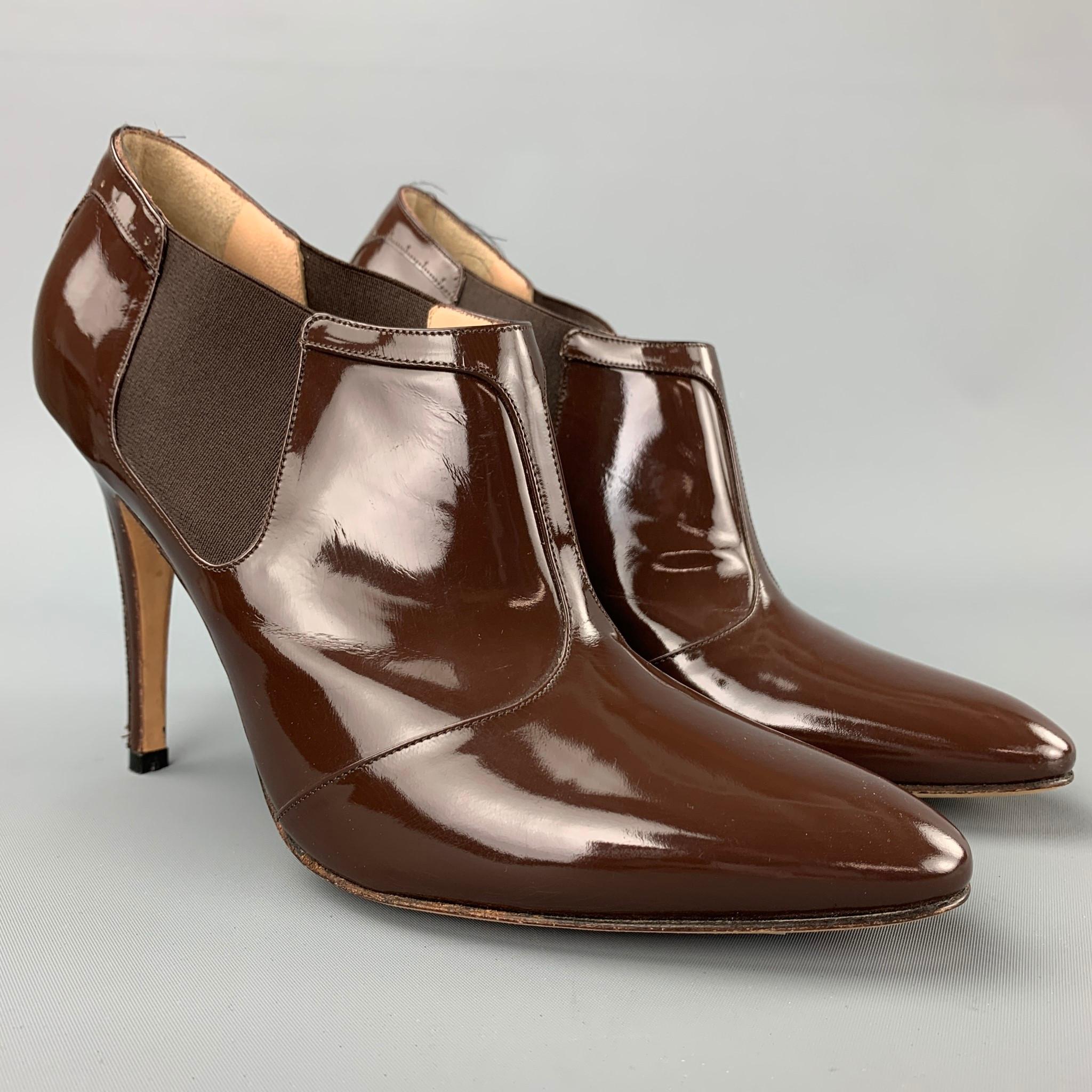 MANOLO BLAHNIK booties comes in a brown patent leather featuring a pointed toe, elastic side, and a stiletto heel. Made in Italy.

New Without tags. 
Marked: EU 38.5

Measurements:

Heel: 4 in. 