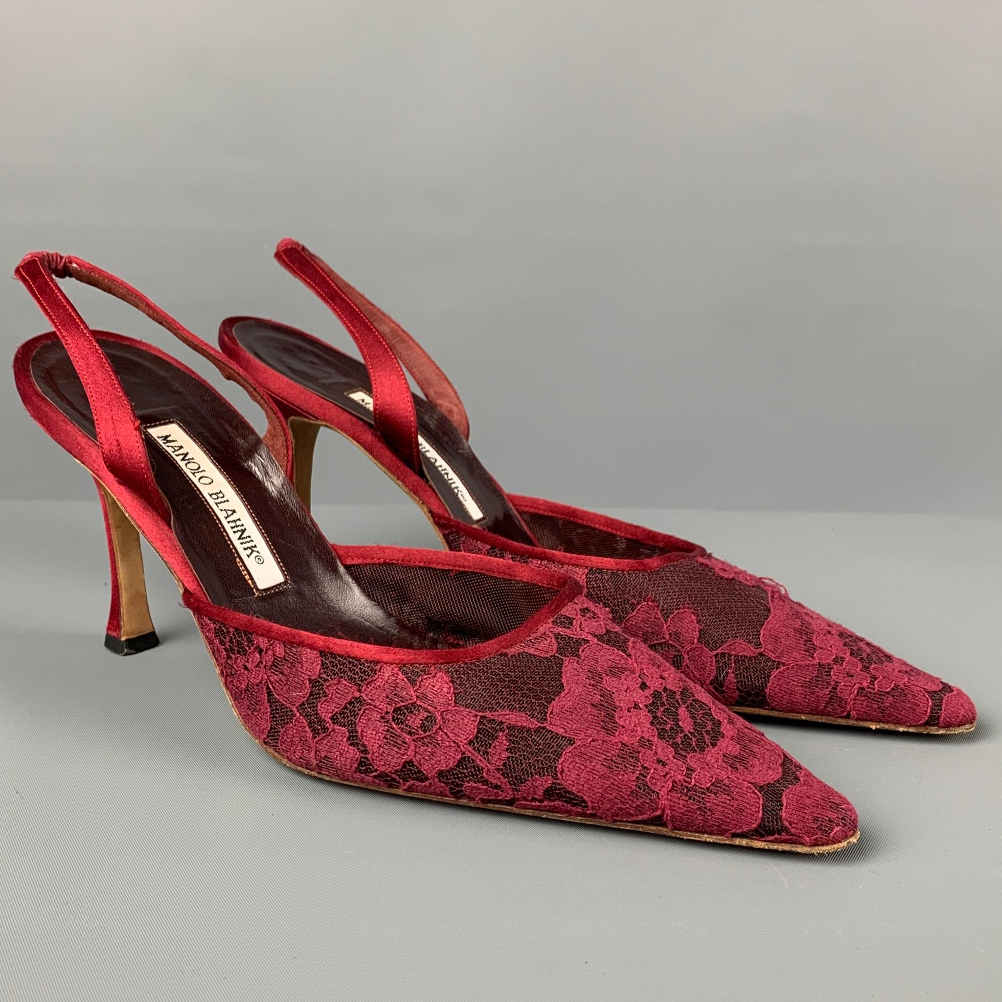 MANOLO BLAHNIK pumps comes in a burgundy lace material featuring a slingback strap, pointed toe, and a stacked heel. Made in Italy. 

Very Good Pre-Owned Condition. Light wear.
Marked: 38.5

Measurements:

Heel: 3.5 in. 