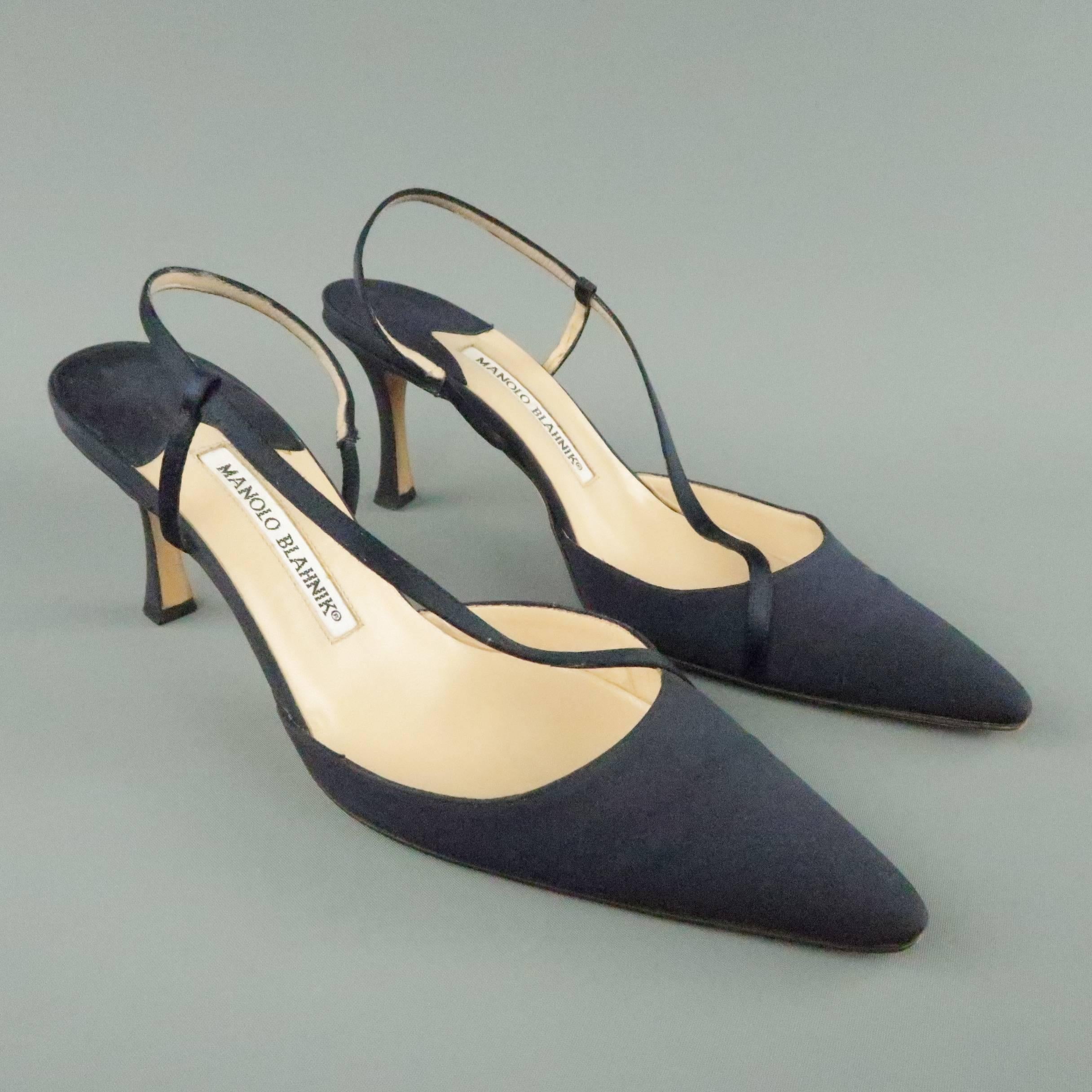MANOLO BLAHNIK pumps come in navy blue fabric and feature a pointed toe, sling back, and diagonal strap. With box. Made in Italy.
 
Good Pre-Owned Condition.
Marked: IT 38.5
 
Heel: 3 in.
