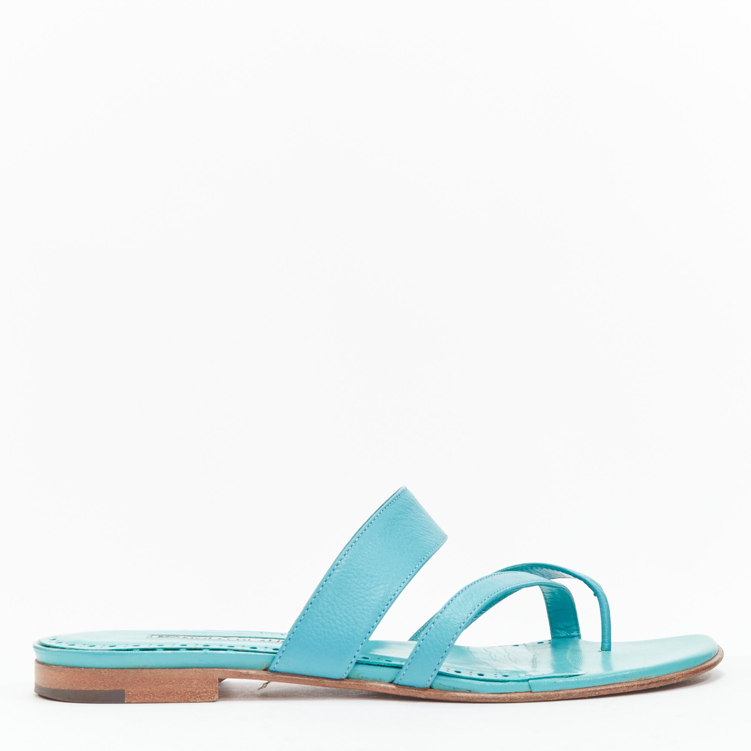 MANOLO BLAHNIK teal blue toe ring crisscross leather strappy sandals EU37.5
Reference: LNKO/A02144
Brand: Manolo Blahnik
Material: Leather
Color: Blue
Pattern: Solid
Closure: Slip On
Lining: Blue Leather
Made in: Italy

CONDITION:
Condition: Good,