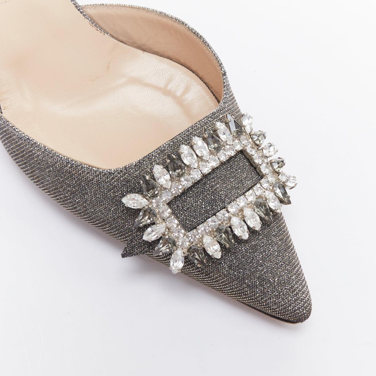 MANOLO BLAHNIK Tonoslac metallic silver fabric crystsal buckle sling heels EU39
Reference: JHDN/A00040
Brand: Manolo Blahnik
Model: Tonoslac
Material: Fabric
Color: Silver
Pattern: Solid
Closure: Slingback
Lining: Nude Leather
Made in: