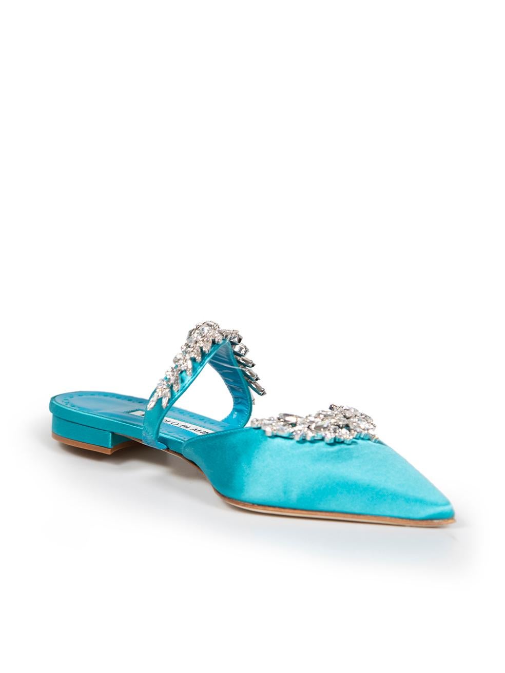 CONDITION is Very good. Minimal wear to shoes is evident. Minimal wear to soles on this used Monolo Blahnik designer resale item.
 
 
 
 Details
 
 
 Model: Lurum
 
 Turquoise
 
 Satin
 
 Mules
 
 Flat
 
 Point toe
 
 Silver crystal embellished