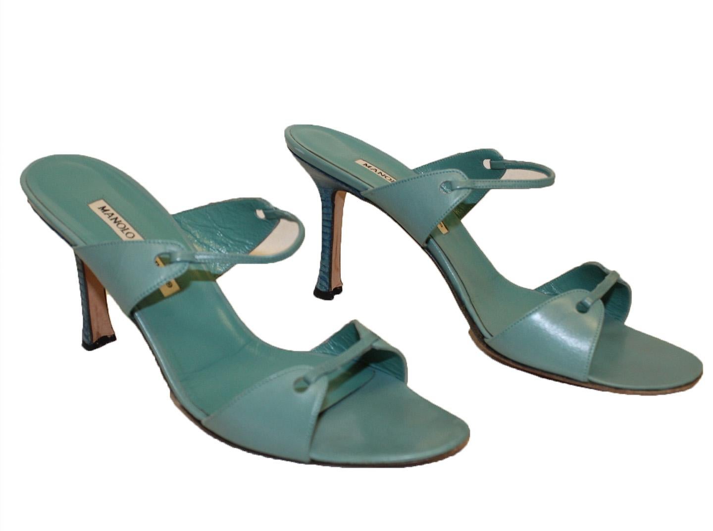 Synonymous with femininity and luxury, iconic Spanish designer Manolo Blahnik exudes a raw elegance that is captured in every footwear silhouette.   These turquoise leather sandals from Manolo Blahnik feature a high stiletto heel, an open back, a