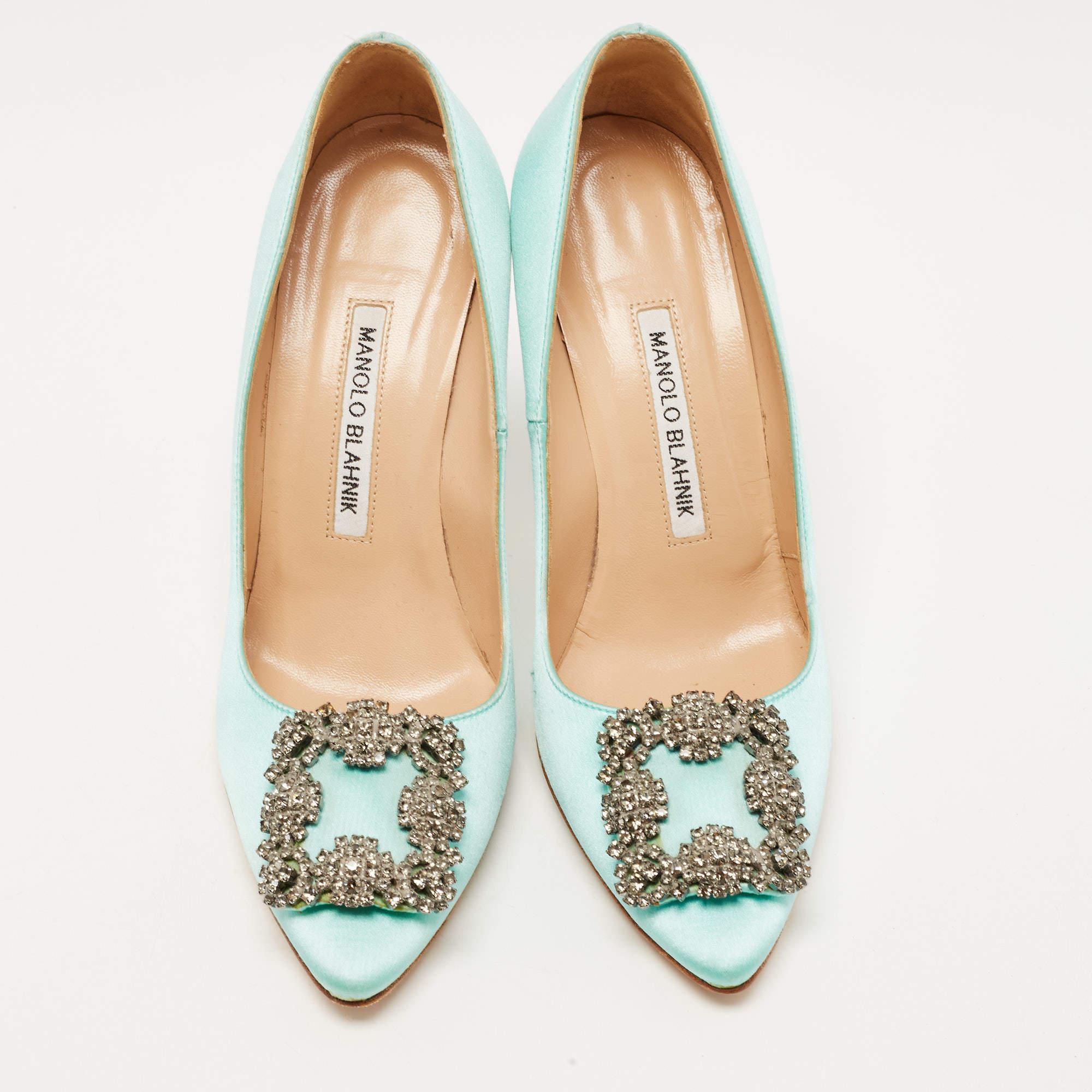 Manolo Blahnik is synonymous with feminine elegance and unquestionable skill. The iconic Hangisi pumps embody the best of the brand. These ones are crafted using turquoise satin and have a crystal-embellished buckle highlighting the toes. They are