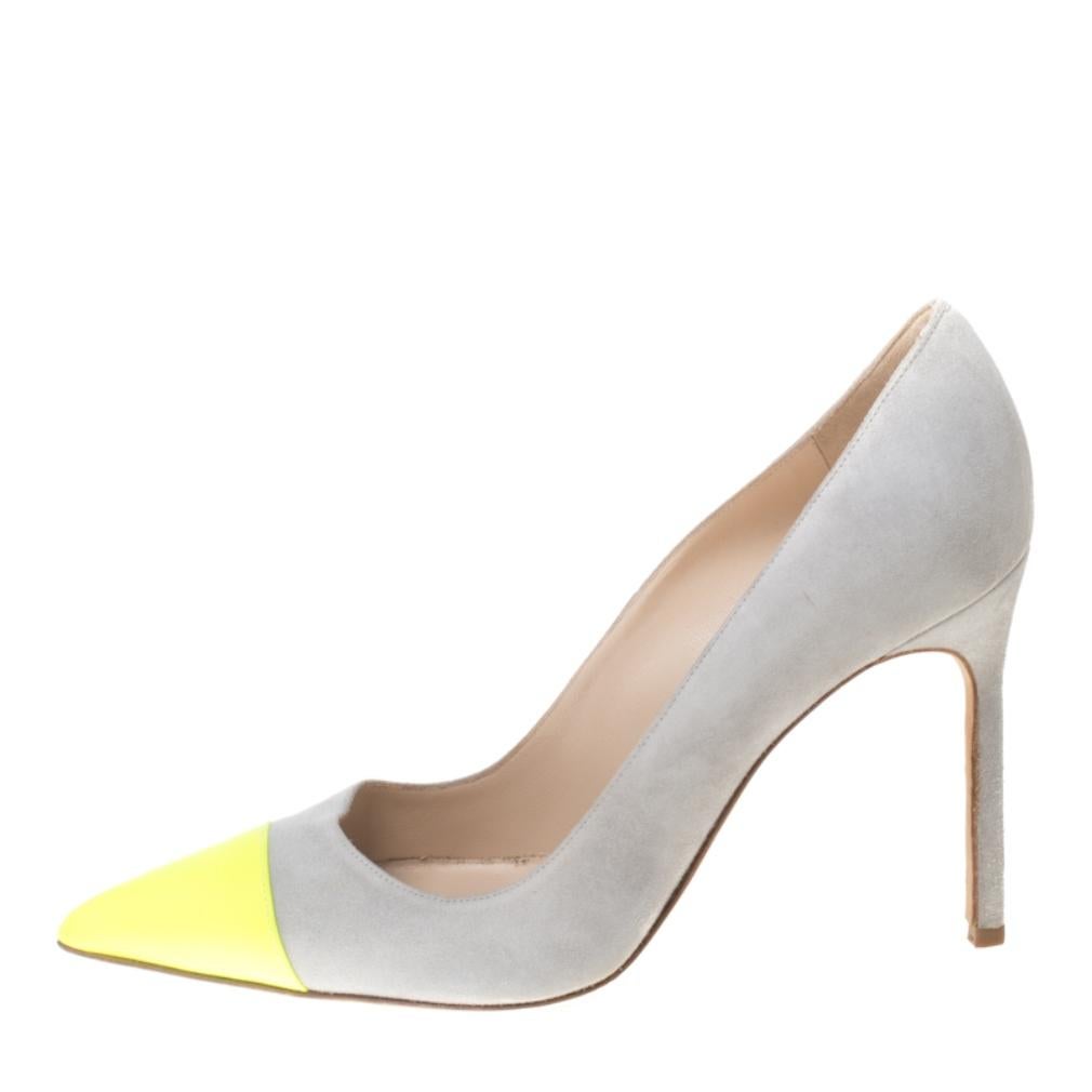 Do modern chic with these Bipunta pumps from Manolo Blahnik. Crafted with suede, the pointed toes of the pair have been styled with contrasting yellow that adds vibrancy. The pumps are graced with high stiletto heels and comfortable insoles. We