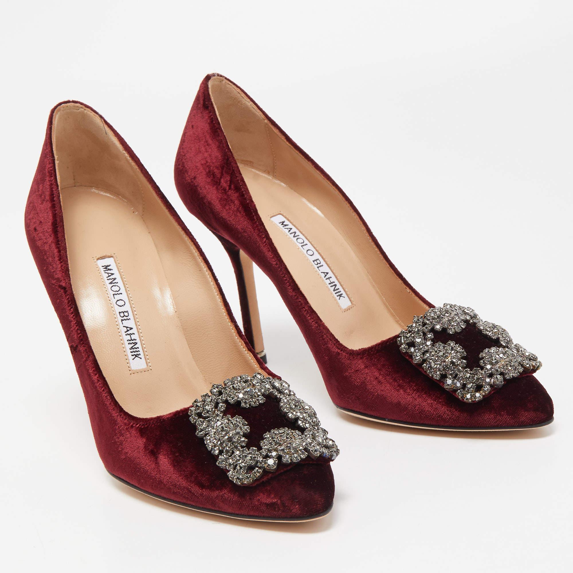 The 10cm heels of this pair of Manolo Blahnik pumps will reflect grace and luxury in every step. Made from velvet, it is made striking with crystal-embellished buckle detailing on the toes and exhibits branded insoles.

