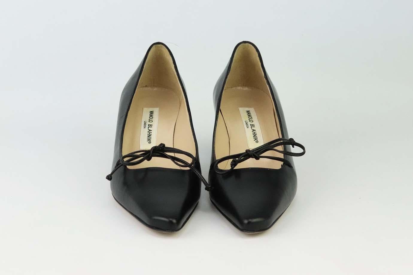 These Vintage pumps by Manolo Blahnik are a classic style that will never date, made in Italy from supple black leather, they have sharp slanted pointed toes, leather bow and comfortable 38 mm heels to take you from morning meetings to dinner with
