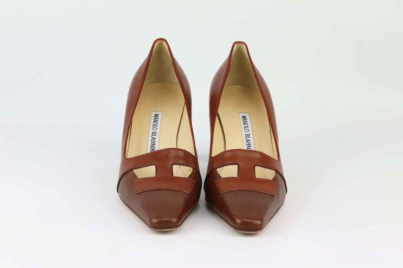 These pumps by Manolo Blahnik are a classic style that will never date, made in Italy from supple brown leather, they have square toes, cutout detail and comfortable 63mm heels to take you from morning meetings to dinner with friends. Heel measures