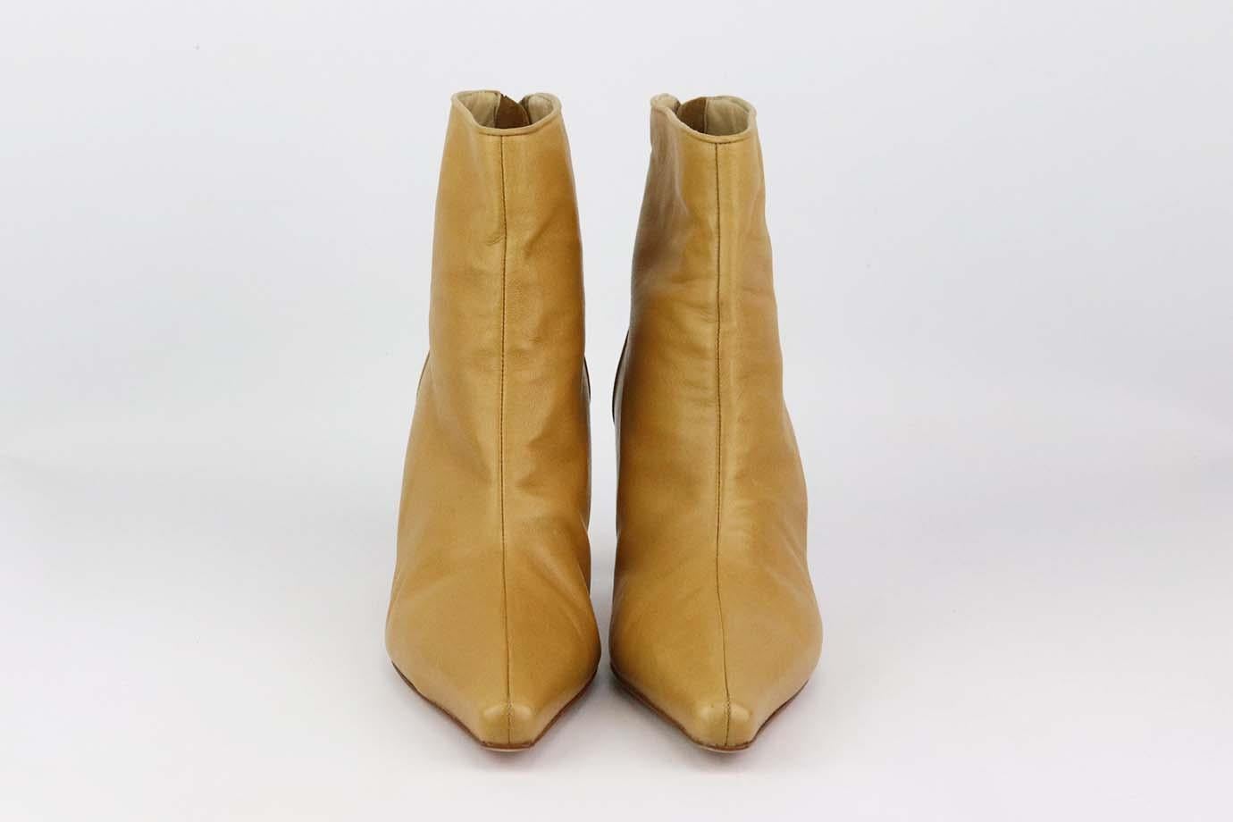 These ankle boots by Manolo Blahnik are a classic style that will never date, made in Italy from supple tan leather, they have pointed. Heel measures approximately 63 mm/ 2.5 inches. Tan leather. Zip fastening at back. Comes with dustbag. Size: EU