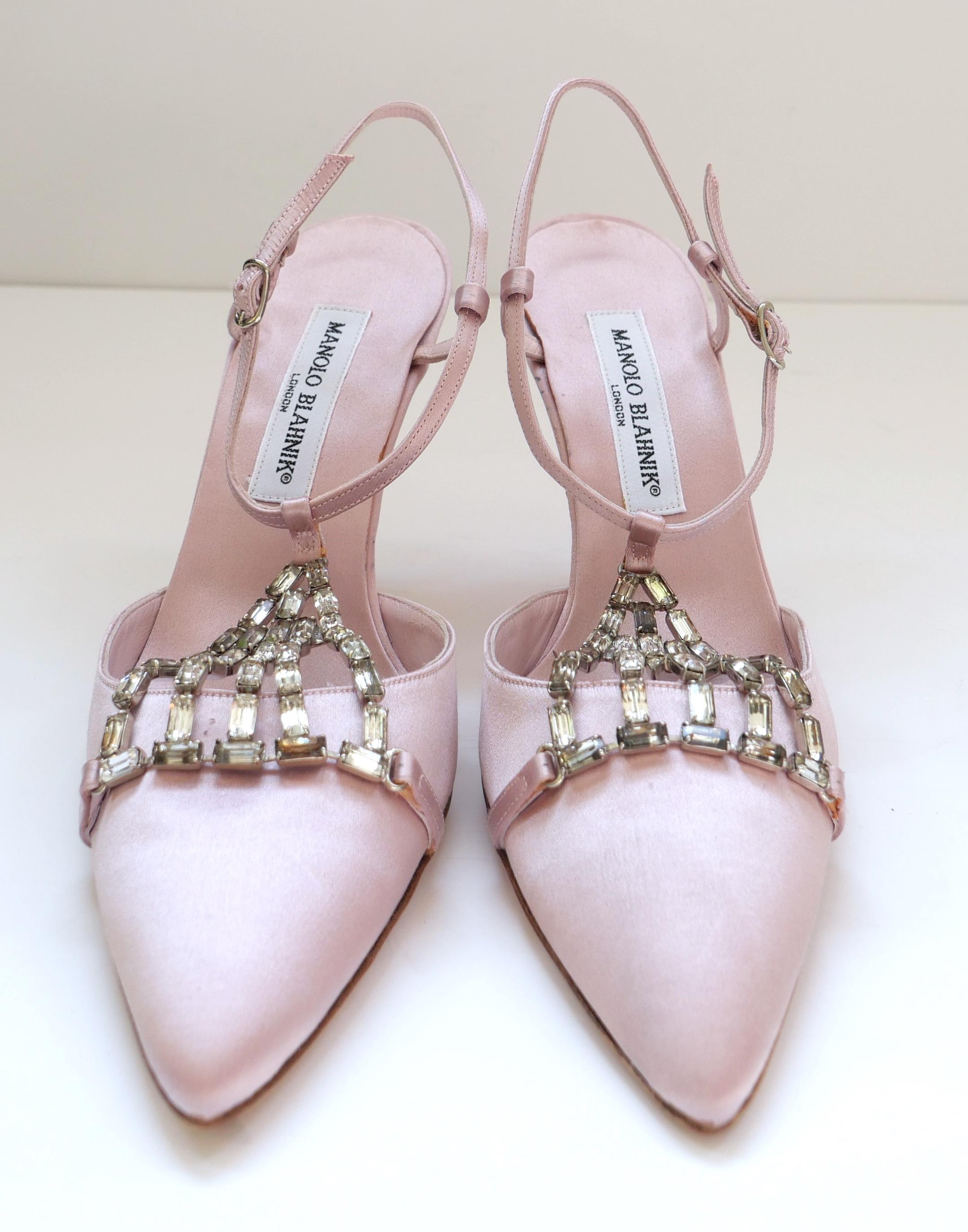 Gorgeous vintage Manolo Blahnik crystal trimmed heels. Come with dustbag. Made from candy pink silk satin with sparkling crystal cage detailing to front. They have delicate sling back straps, pointed toes and mid height heels. Size 39. Measure