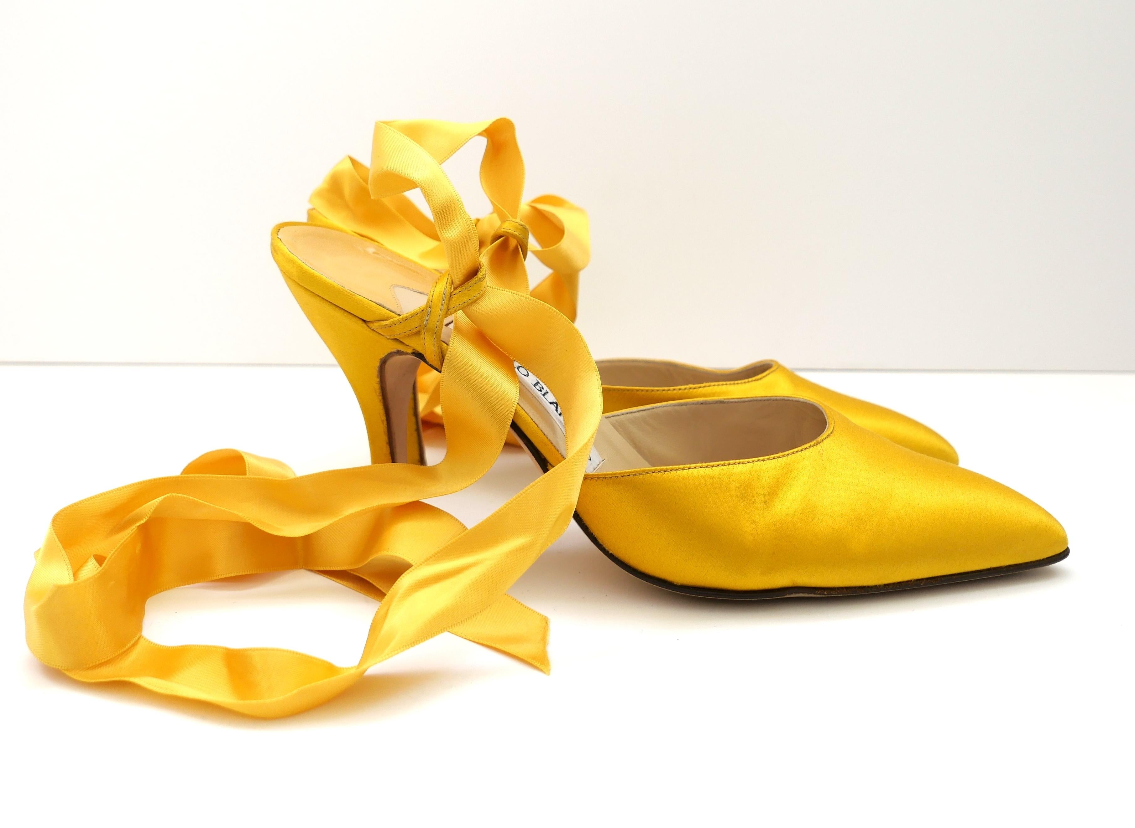 Gorgeous vintage Manolo Blahnik silk ankle tie heels. Worn once and come with dustbag. Made from glossy golden mustard silk with coordinating ribbon ankle ties and mid height heels. Size 39. Measure approx - 10.25” heel to toe and heel 4”. 
