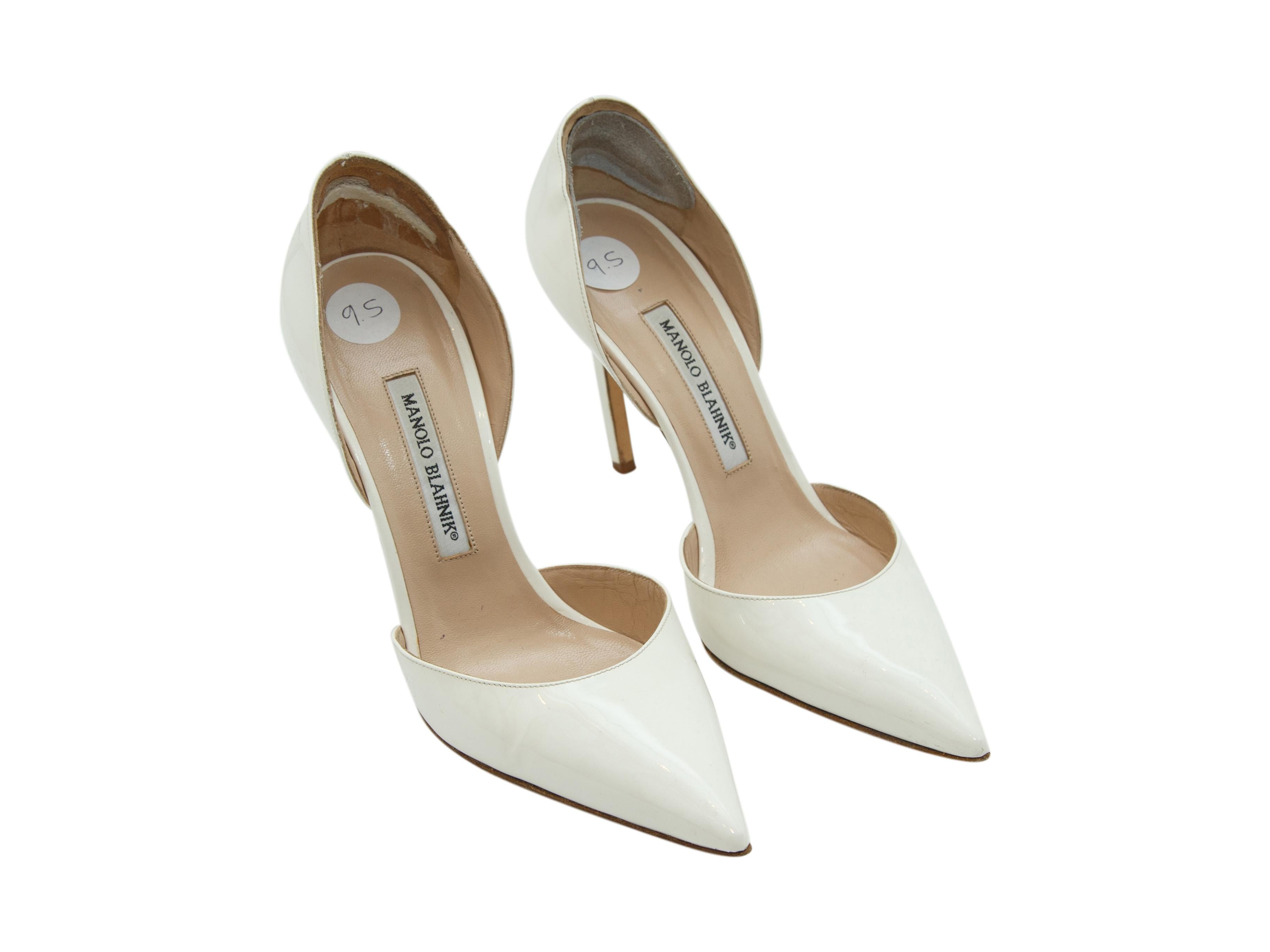 Product details:  White patent leather d'Orsay pumps by Manolo Blahnik.  Point toe.  Slip-on style.  
Condition: Pre-owned. Very good. 
Est. Retail $ 665.00