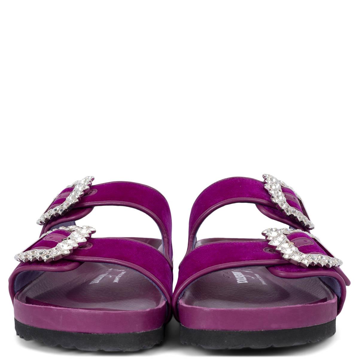 100% authentic Manolo Blahnik x Birkenstock Arizona sandals in fuchsia pink velvet and leather adorned with iterations of Manolo’s iconic sparkling square buckles. Have been worn once inside and are in virtually new condition. 

2020