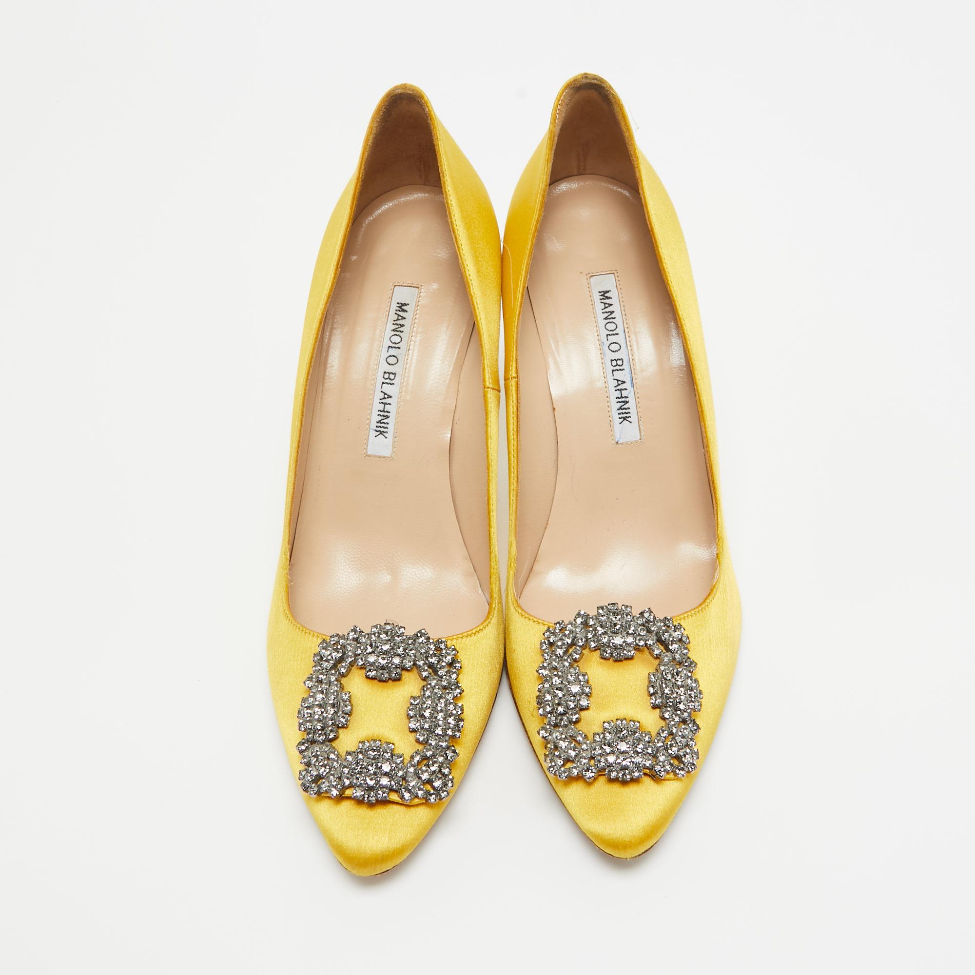 The 9cm heels of this pair of Manolo Blahnik pumps will reflect grace and luxury in every step. Made from satin, it is made striking with crystal-embellished buckle detailing on the toes and exhibits branded insoles.

