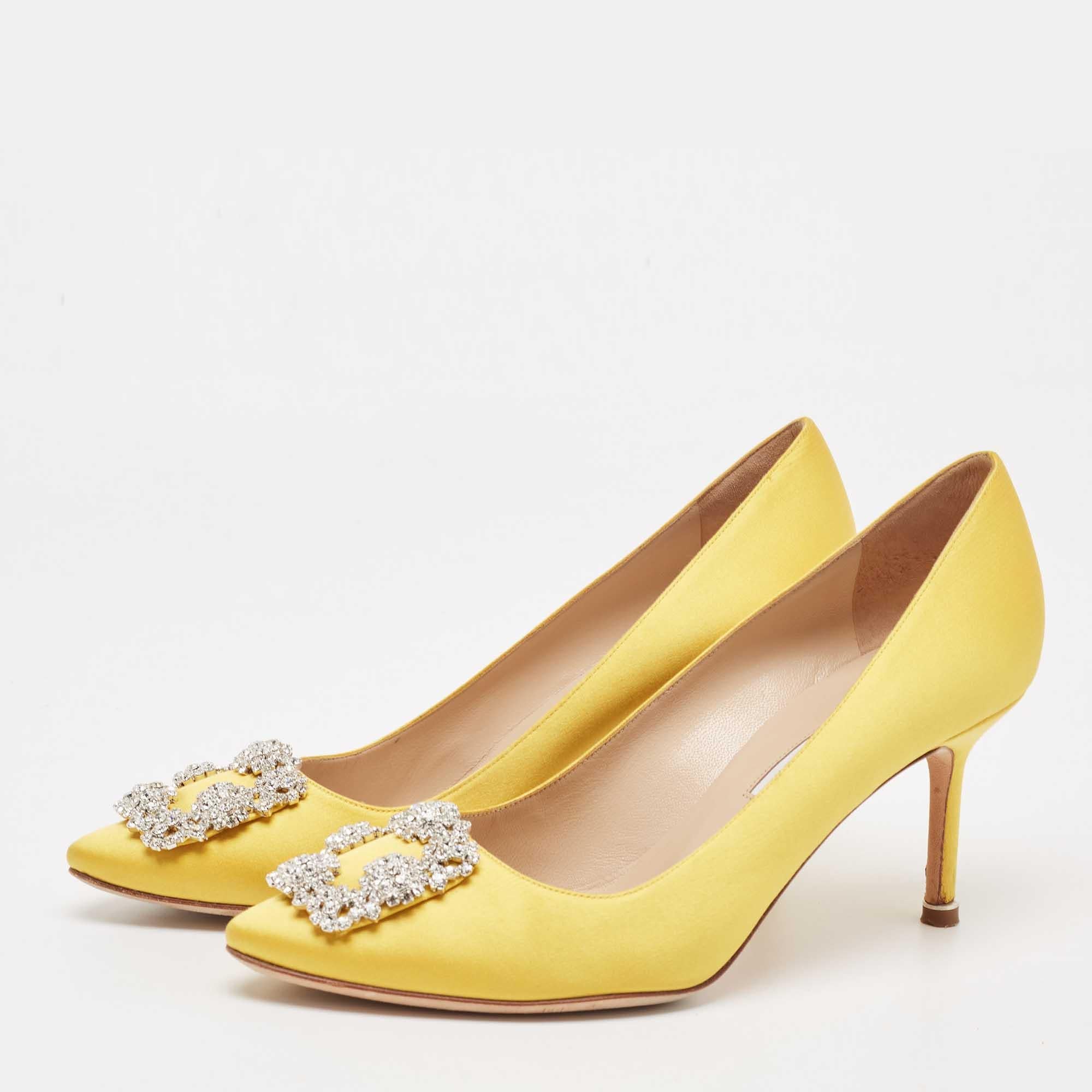 The 8cm heels of this pair of Manolo Blahnik pumps will reflect grace and luxury in every step. Made from satin, it is made striking with a crystal-embellished buckle detailing on the toes and exhibits branded insoles.

Includes: Original Dustbag,