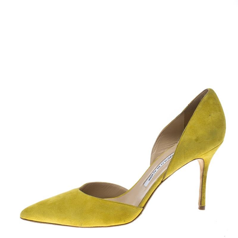 Crafted from suede in a D'orsay style with pointed toes, these Manolo Blahnik pumps come ready to give you a high-fashion experience. The bright yellow pumps, with sharp-cut toplines, are balanced on 9 cm heels and finished with comfortable insoles.