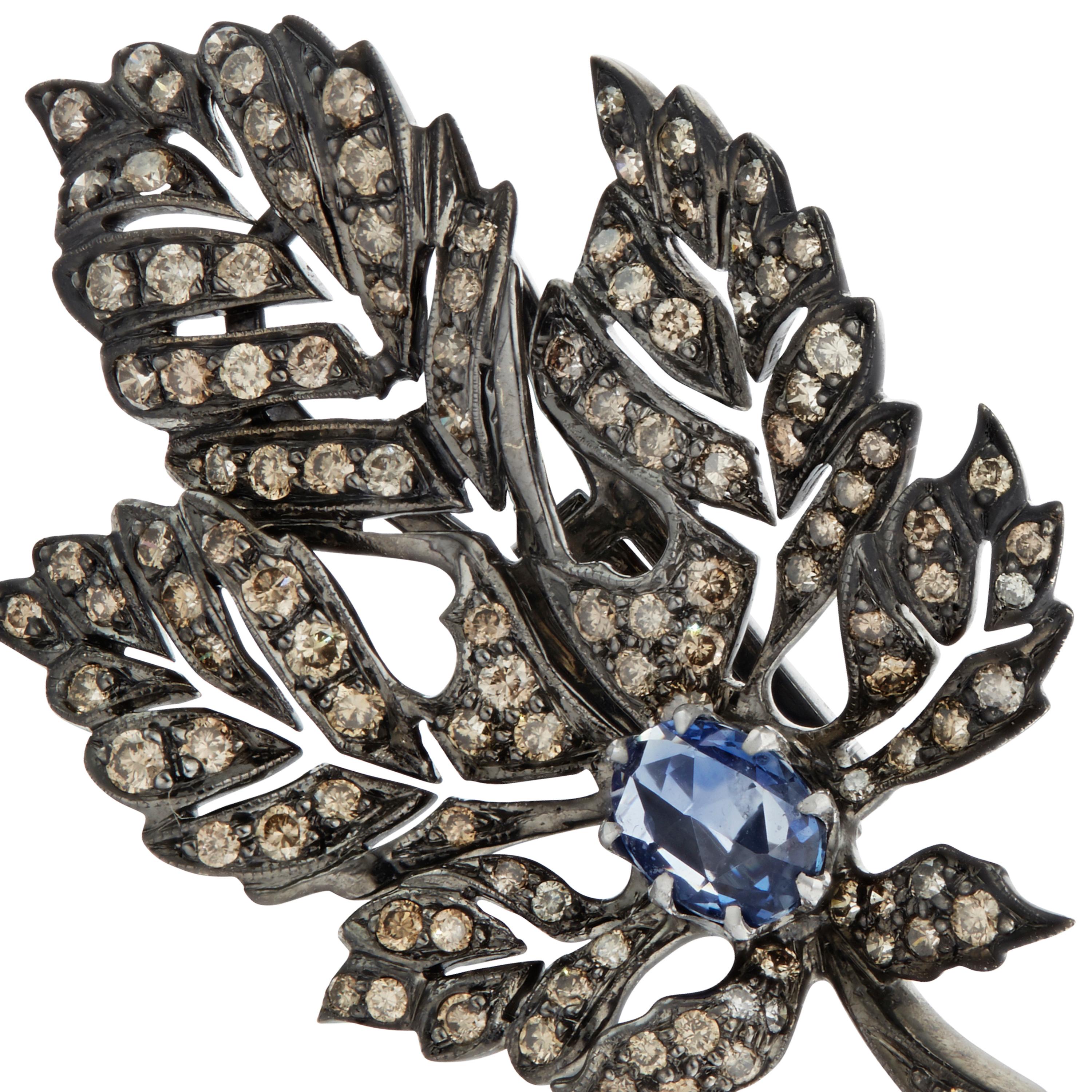 Gold: 22.60 grams
Blue Sapphire: 1.57 carats 
Diamond: 3.13 carats 

Inspired by antique Victorian designs from the natural world, Manpriya B's leaf earrings are perfectly sculpted to frame your face with their softly glittering leaves.  Brown