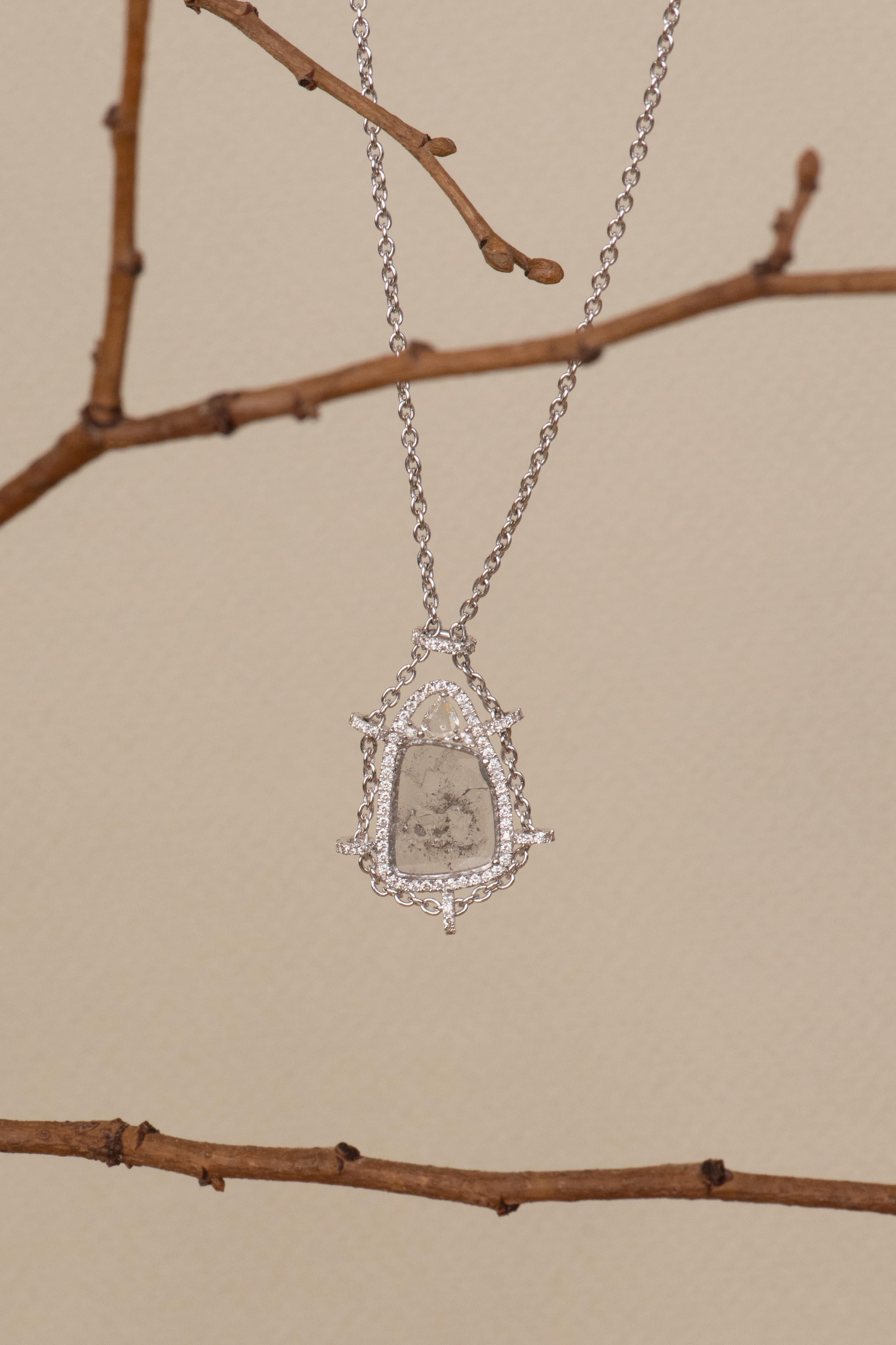 Gross weight: 11.000 grams
Gold weight: 10.500 grams 
Slice Diamond Weight: 1.52 carats 
Diamond Weight: 0.55 carats 
White Sapphire Weight: 0.43 carats 

The necklace measures 43 cm in length, with pendant drop of 30 mm and measures 18 mm at the