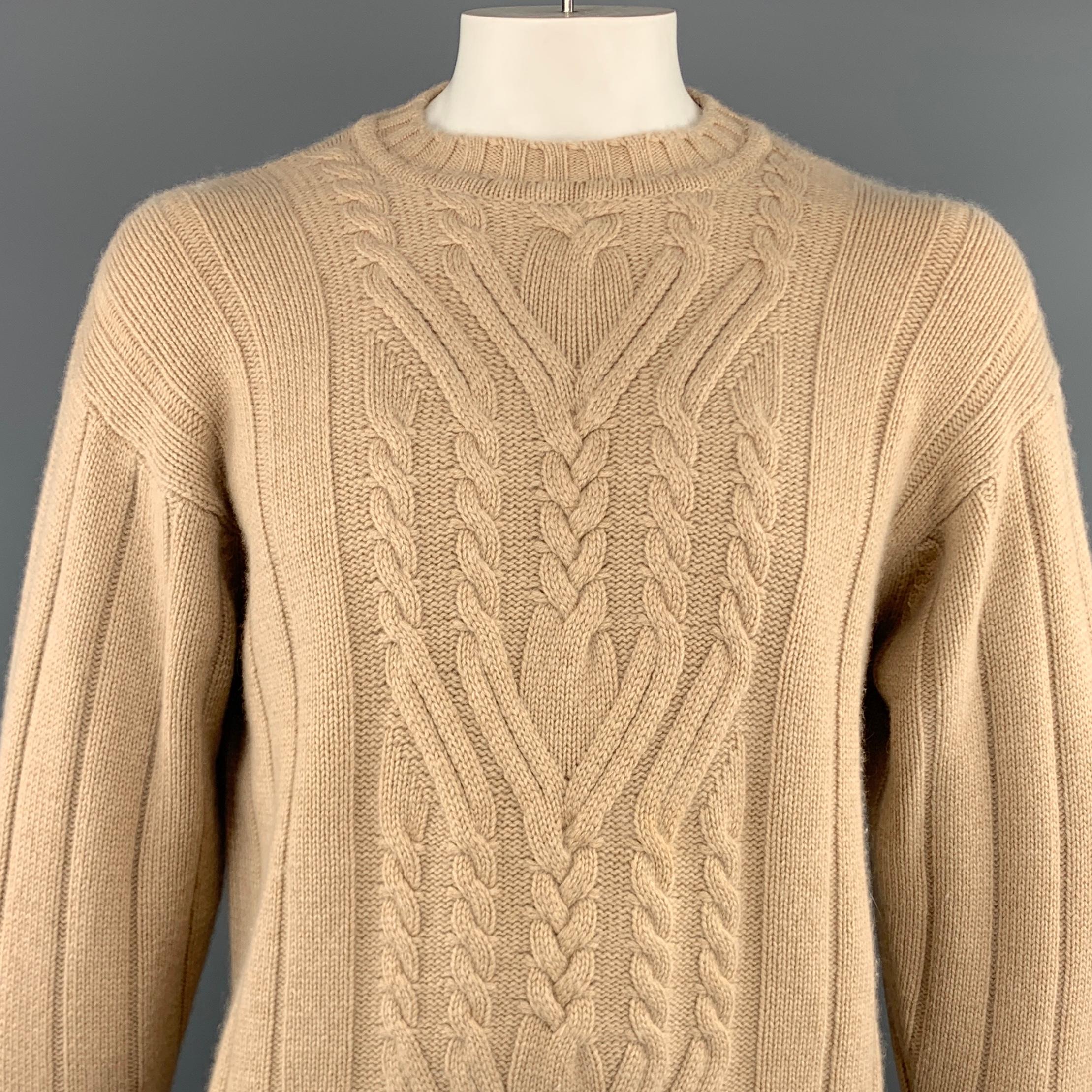 MANRICO sweater comes in a tan cable cashmere featuring a crew-neck style. Made in Italy.
 
Excellent Pre-Owned Condition.
Marked: 52
 
Measurements:
 
Shoulder: 24.5 in.
Chest: 51 in.
Sleeve: 26.5 in.
Length: 30.5 in.