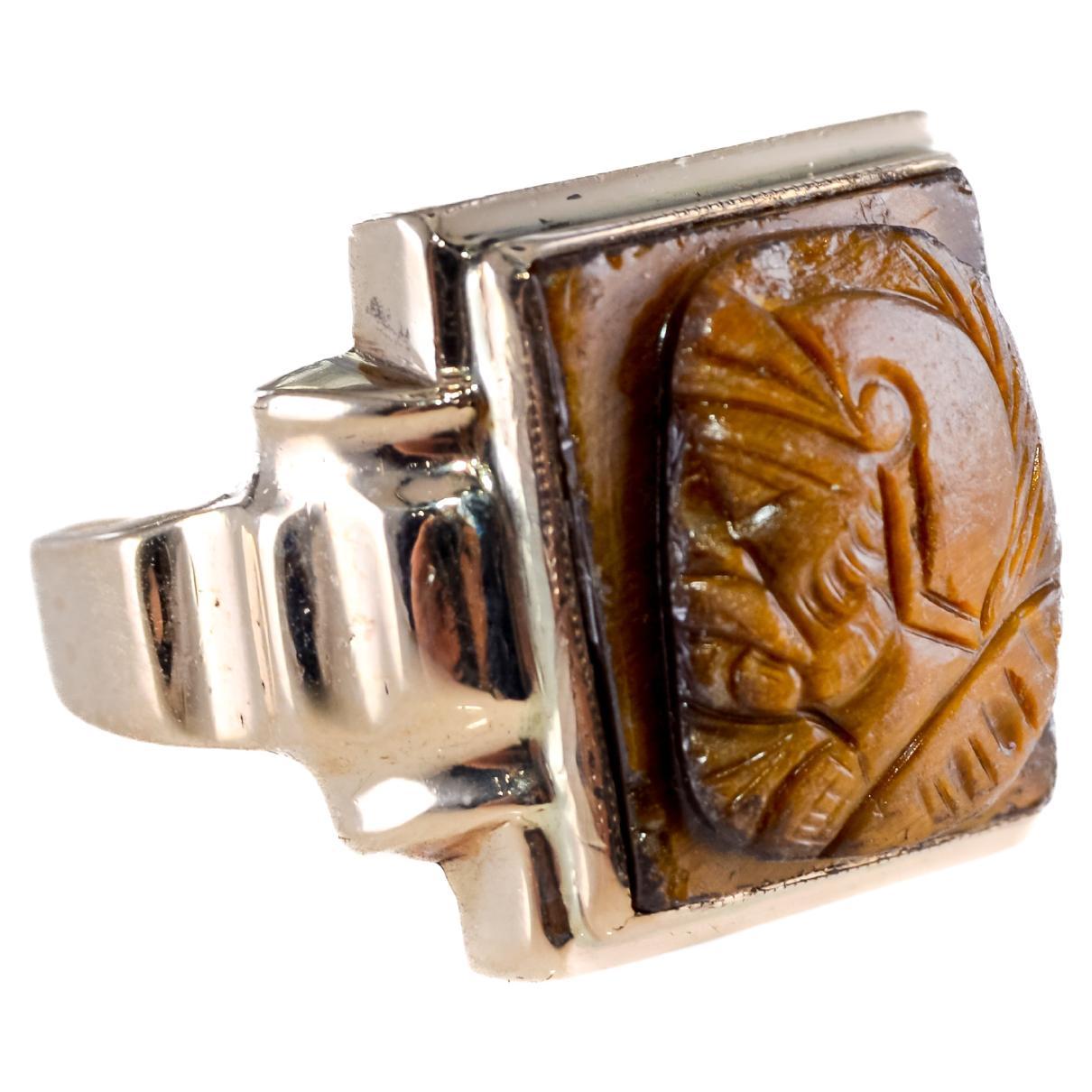UNISEX RING
STYLE / REFERENCE: Art Deco Ring
METAL / MATERIAL: 10Kt. Solid Gold
CIRCA / YEAR: 1940's
CENTER STONE / WEIGHT: Tiger Eye or Metamorphic Chalcedony 
SIZE: 9

This unique ring is entirely hand made with a hand carved center stone. the