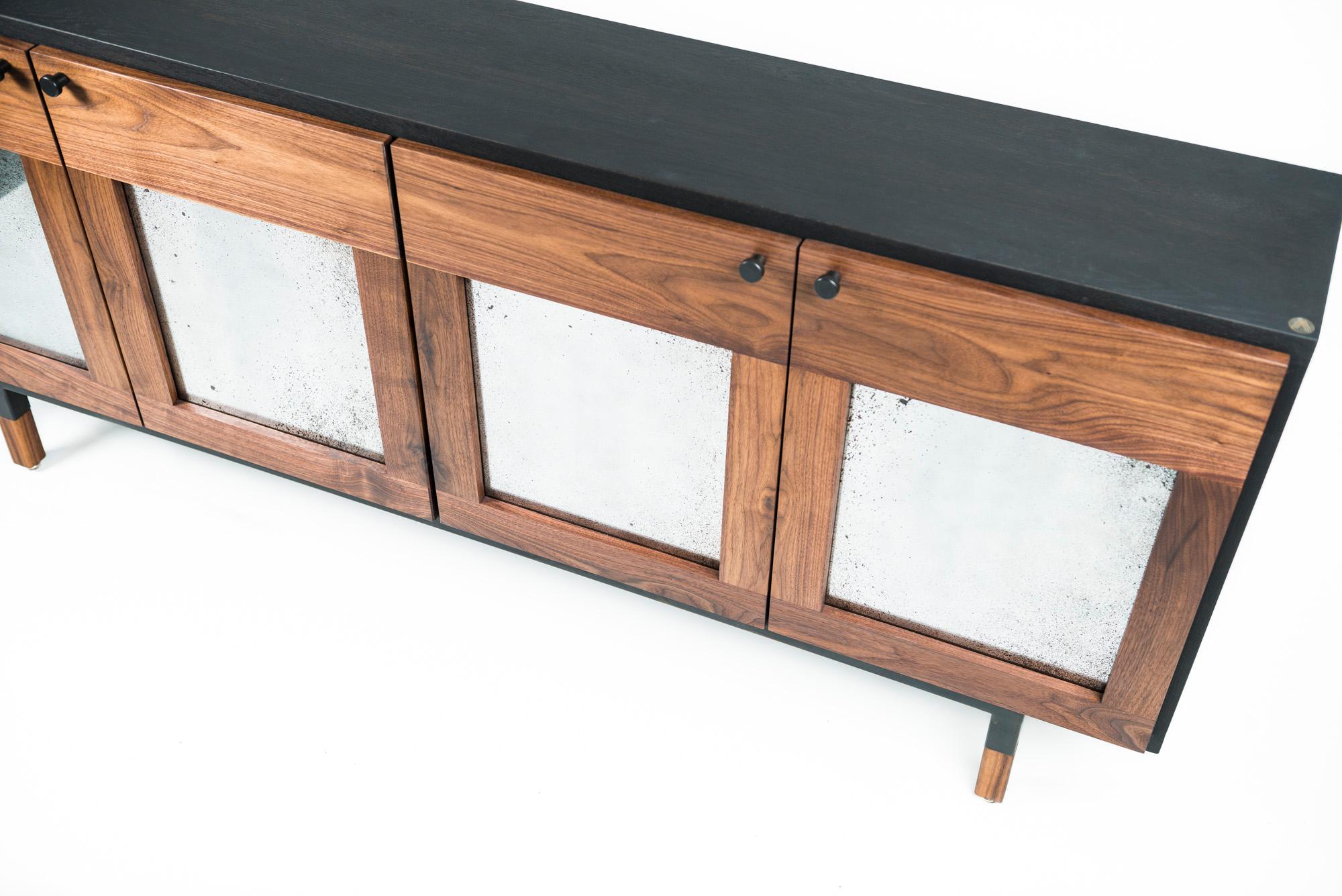 The Mansfield credenza is handcrafted from hand selected solid wood supported by a hand blackened steel frame with solid wood tenon. Designed to store and display valuable dishes, drinks of great occasions and some objects used during the meal. The