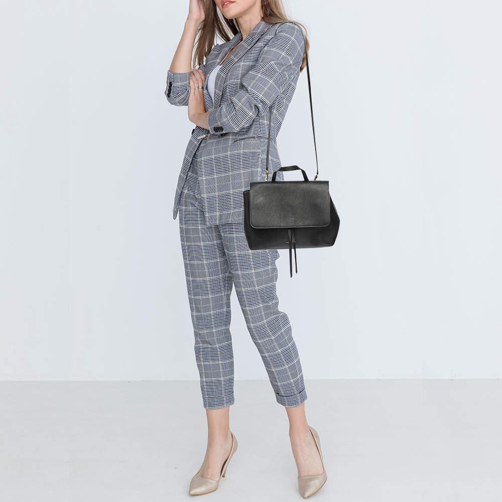 Structured sophisticated and stylish are some words that describe this shoulder bag Crafted from quality materials the creation is adorned with the labels signature appeal and equipped with a well spaced interior.